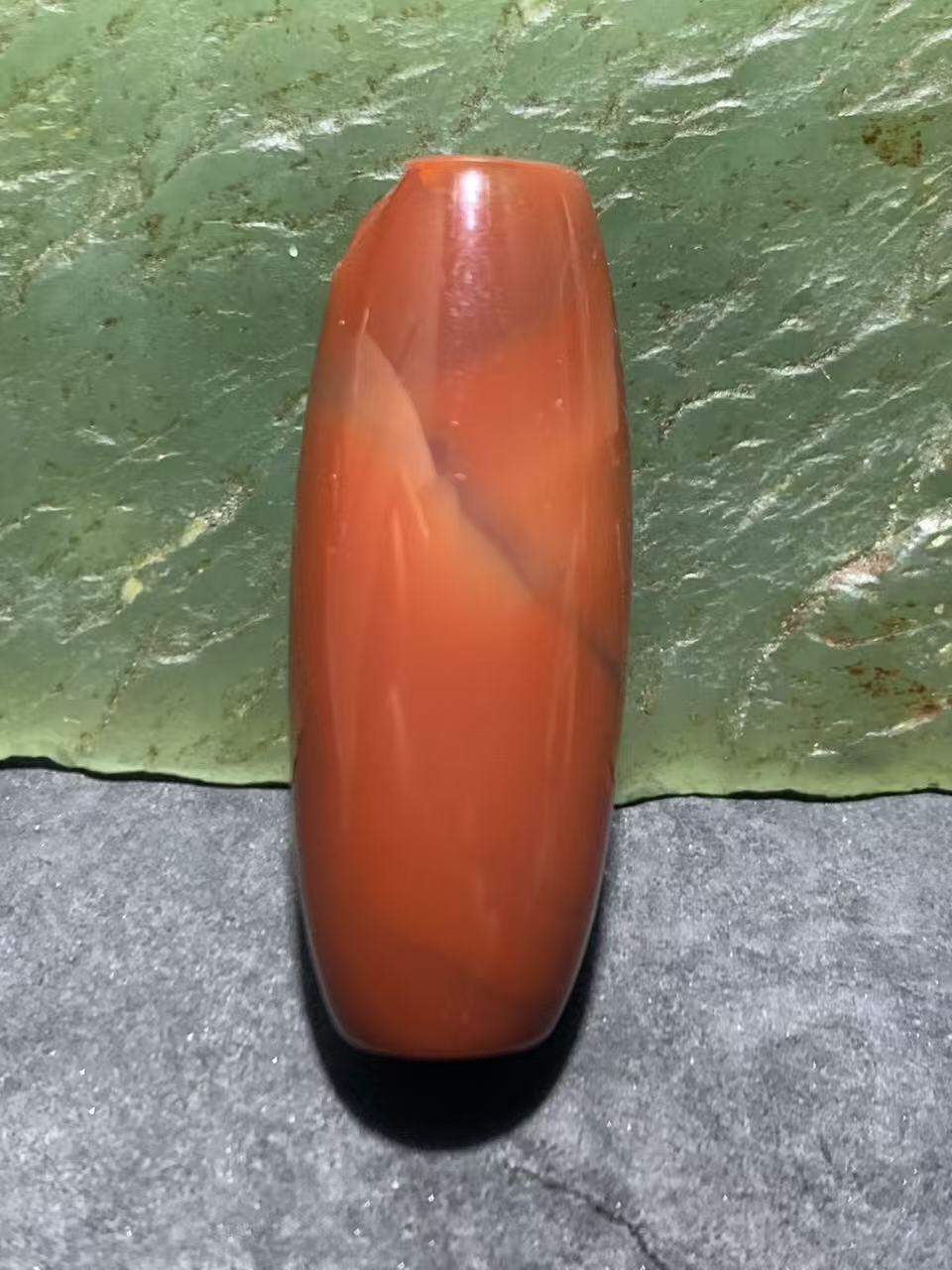 高玉化北漂战国红玛瑙瑕疵桶珠一个！