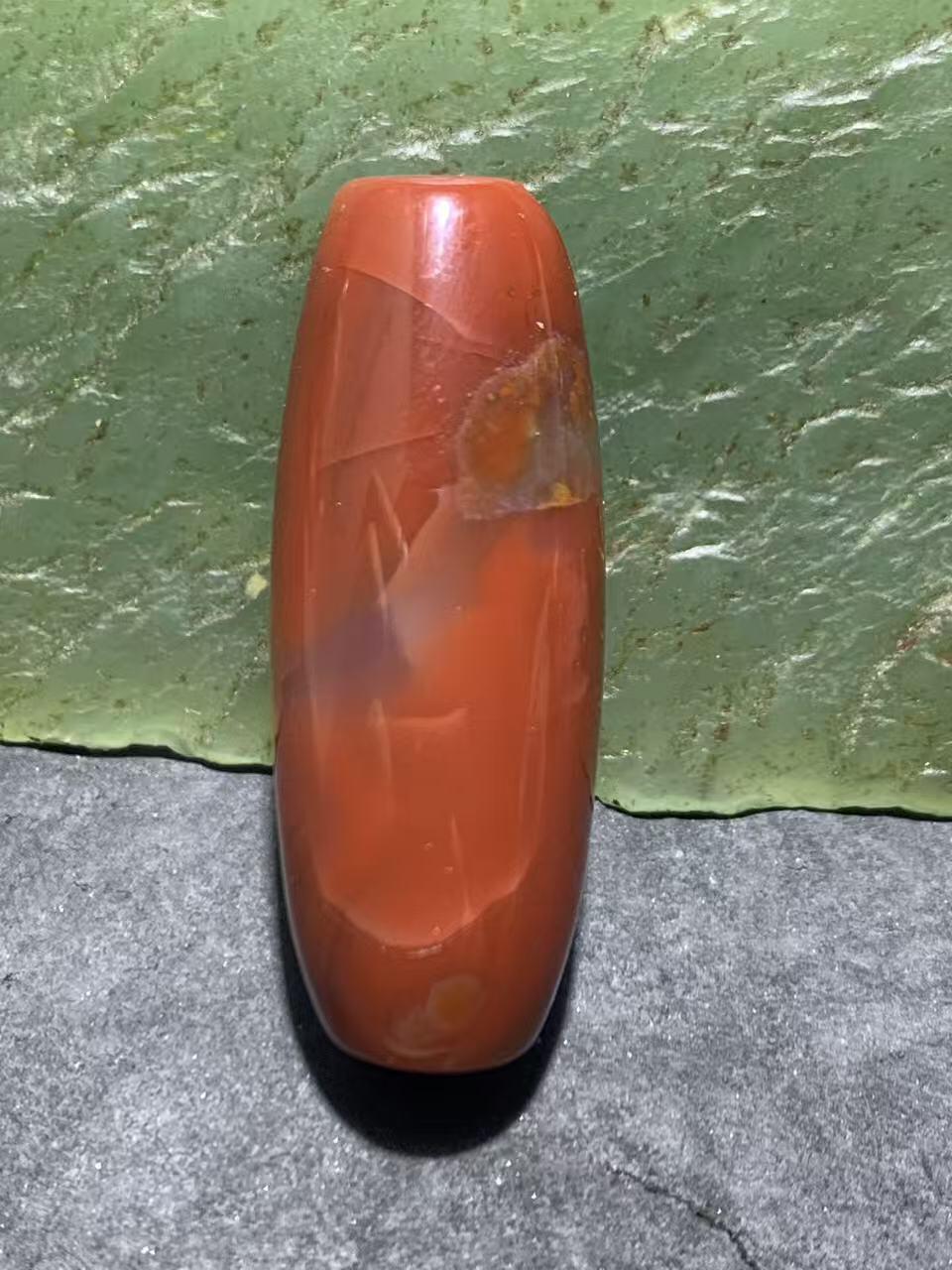 高玉化北漂战国红玛瑙瑕疵桶珠一个！