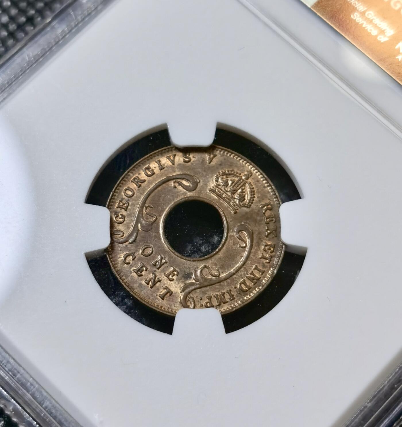 甄臻铺-世界币章拍卖（第40期）送拍享返佣金等优惠多多 NGC-MS63BN 英属东非中孔一分，有趣的中孔币，铜光满溢，状态非常好，经典殖民地品种