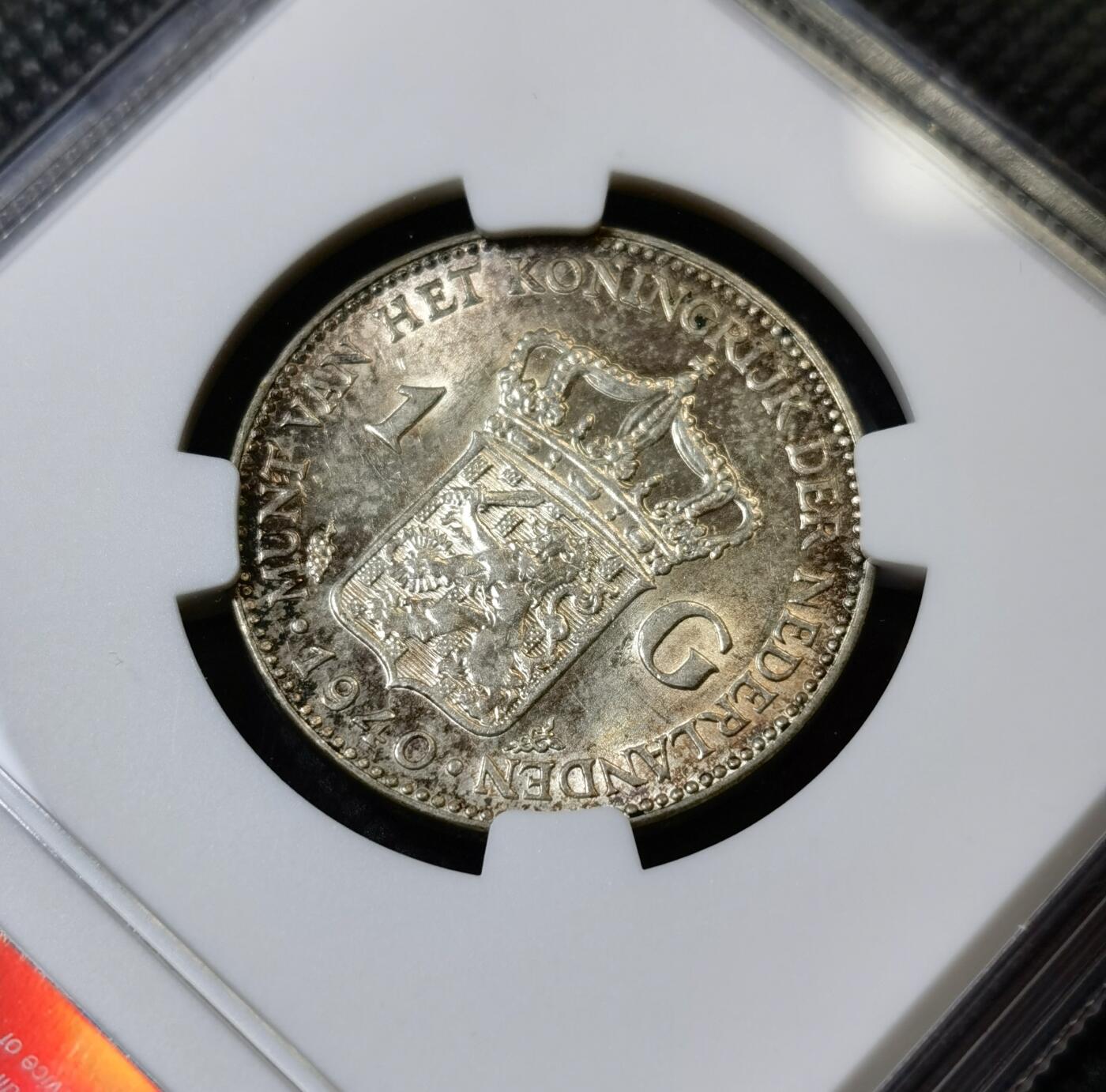 甄臻铺-世界币章拍卖（第40期）送拍享返佣金等优惠多多 NGC-UNCD 荷兰1940一盾银币，状态不错，看不出来清洗的痕迹，关币的银价就80多元