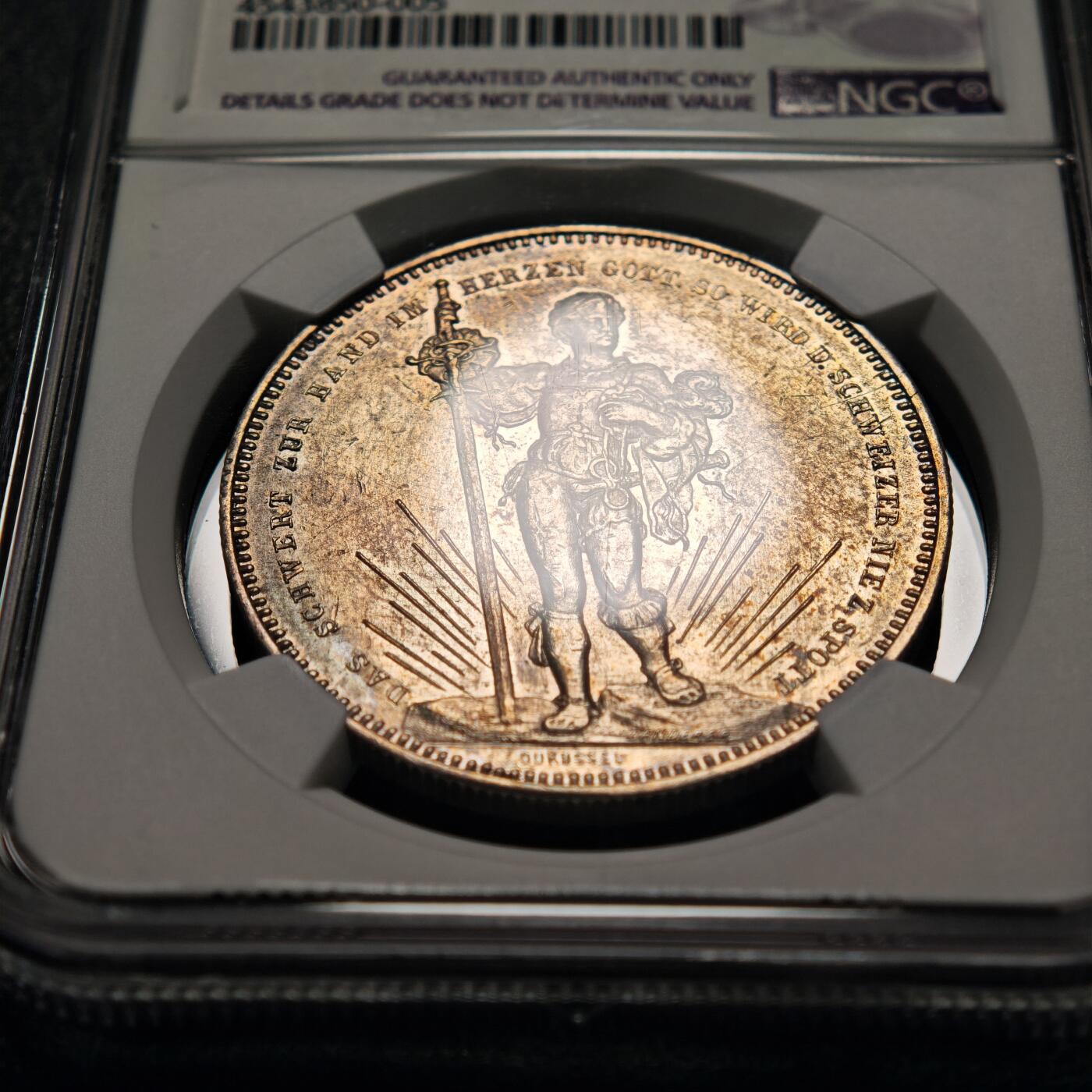 【德藏】世界币章拍卖第155期（拍品征集中~欢迎藏友联系） 1879年 瑞士巴塞尔射击节5法郎纪念银币 NGC AU 正面是手持长剑的士兵形象 背面是瑞士联邦徽章和鹰头图案 铸造精美 淡淡包浆 品相完好