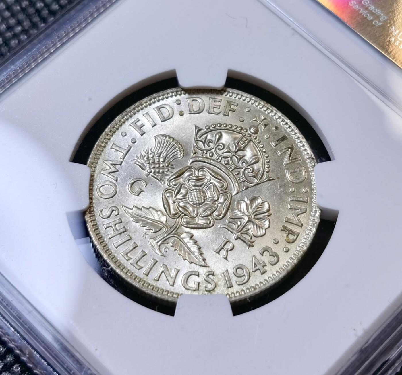 甄臻铺-世界币章拍卖（第40期）送拍享返佣金等优惠多多 NGC-MS62 英国1943年乔治六世弗洛林银币，原色银光，63-64状态，遇上低评了