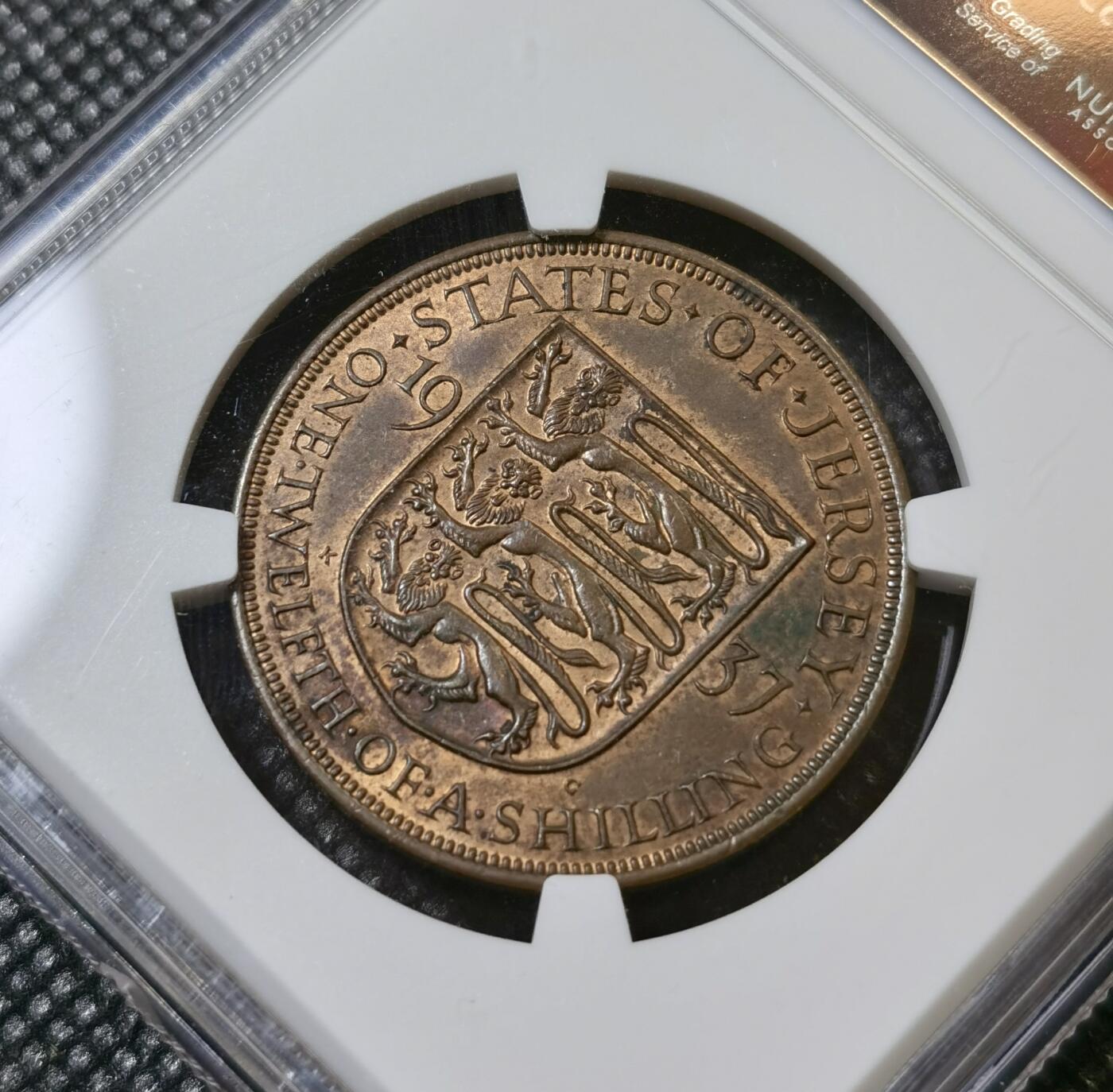 甄臻铺-世界币章拍卖（第40期）送拍享返佣金等优惠多多 NGC-MS62BN 英属泽西岛1937 1/12先令铜币，乔六登基首年，温润状态，比本土便士少见的多