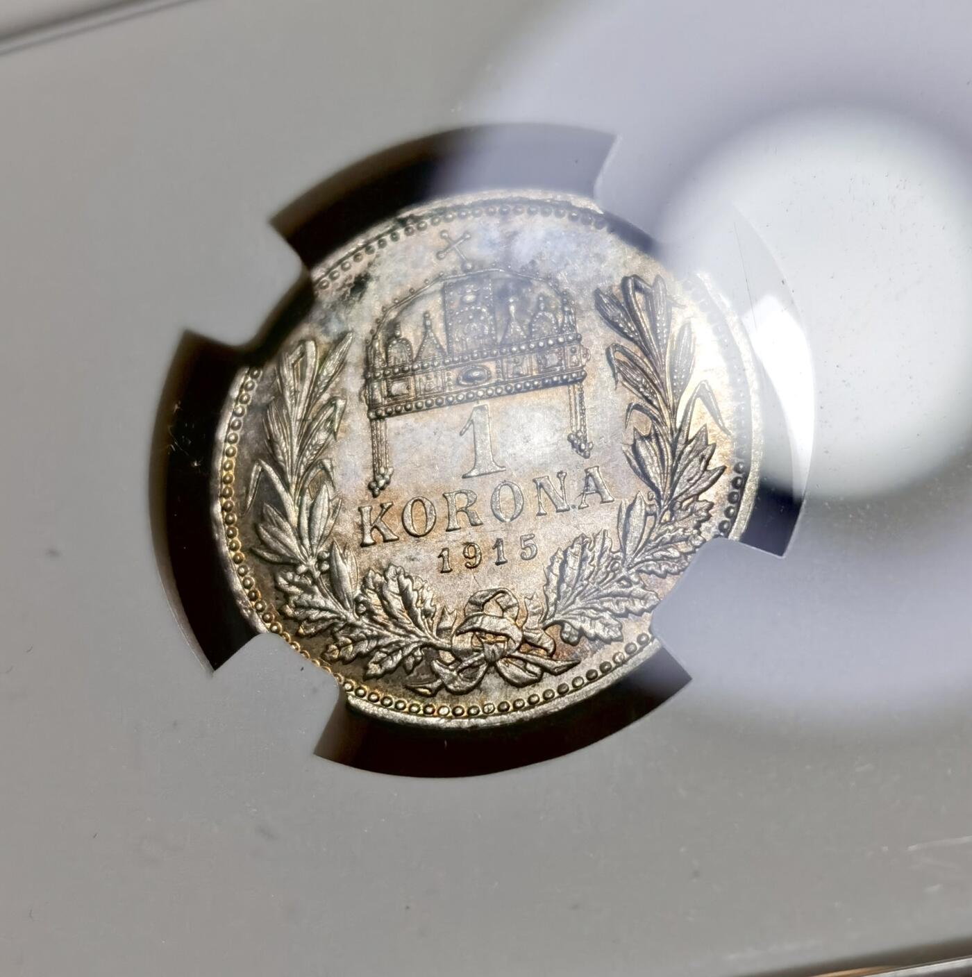 甄臻铺-世界币章拍卖（第40期）送拍享返佣金等优惠多多 NGC-MS63 奥匈帝国1915科罗娜银币，很少见的匈牙利版，正面环五彩包浆，背面镜面感非常强，状态满分的一枚，略有低评