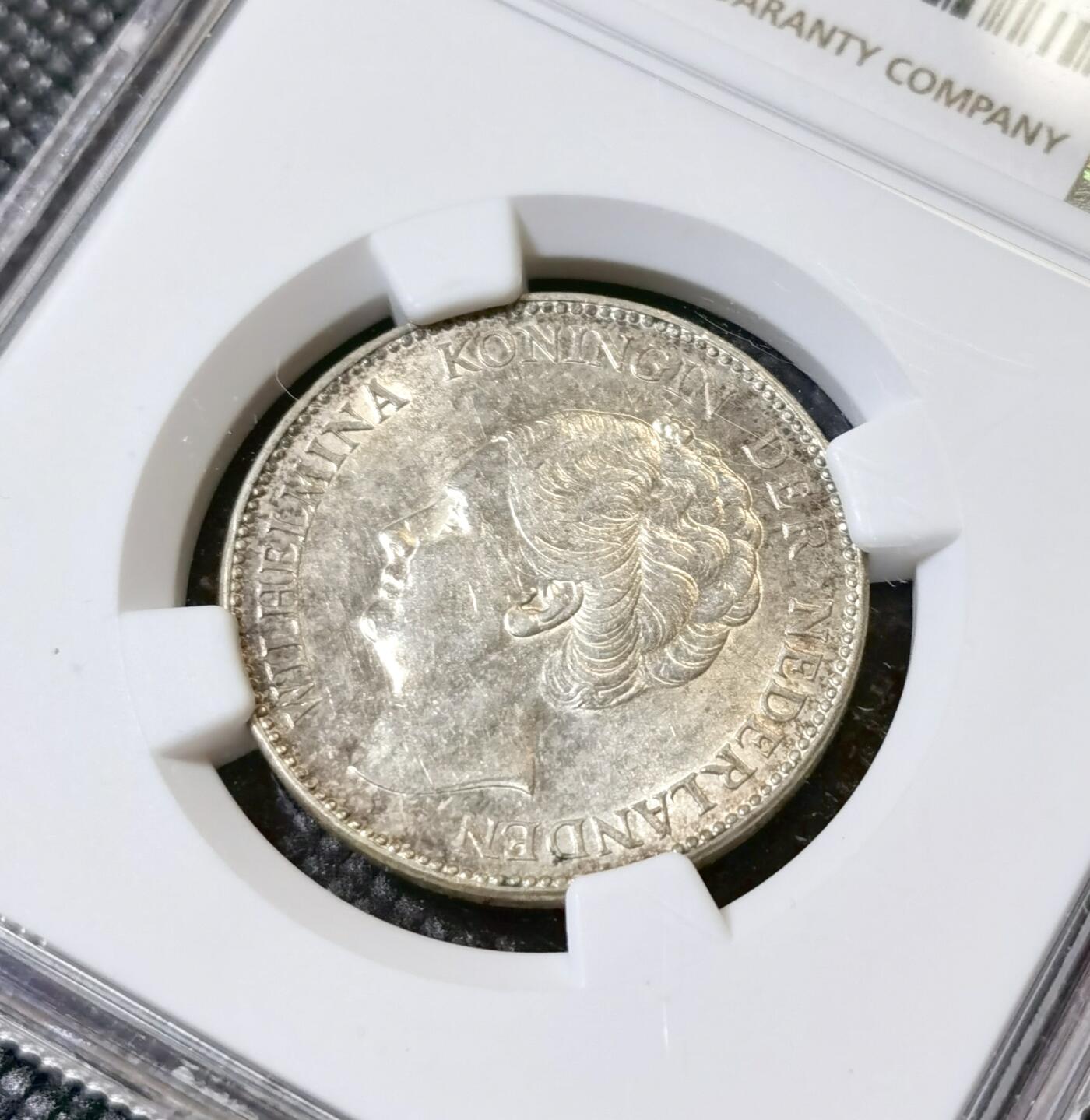 甄臻铺-世界币章拍卖（第40期）送拍享返佣金等优惠多多 NGC-UNCD 荷兰1940一盾银币，状态不错，看不出来清洗的痕迹，关币的银价就80多元