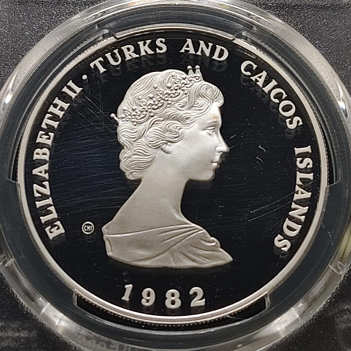 【全场包邮】纯粹捡漏拍481场（免费代拍第18场） 【少见】特克斯和凯克斯群岛1982年10克朗国际儿童年精制纪念银币-量7928-PCGS PR69 DCAM