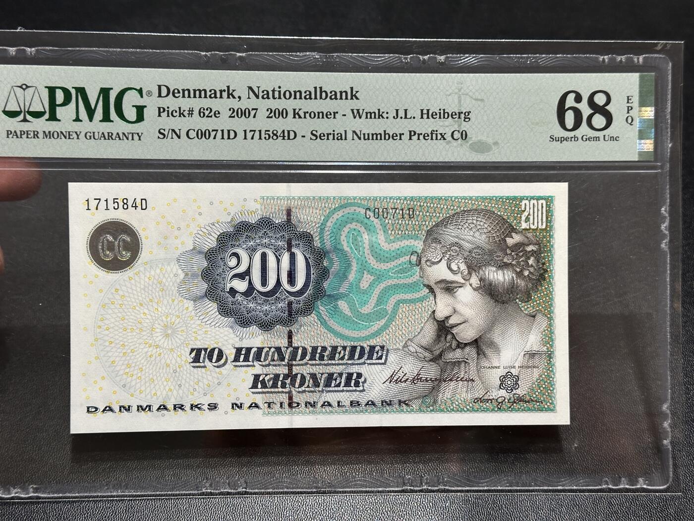 《外钞收藏家》第五百八十八期（优质场）（本平台长期征集拍品、欢迎藏友们联系合作） 丹麦2007年浮雕版200克朗PMG68（女歌剧家海博格）