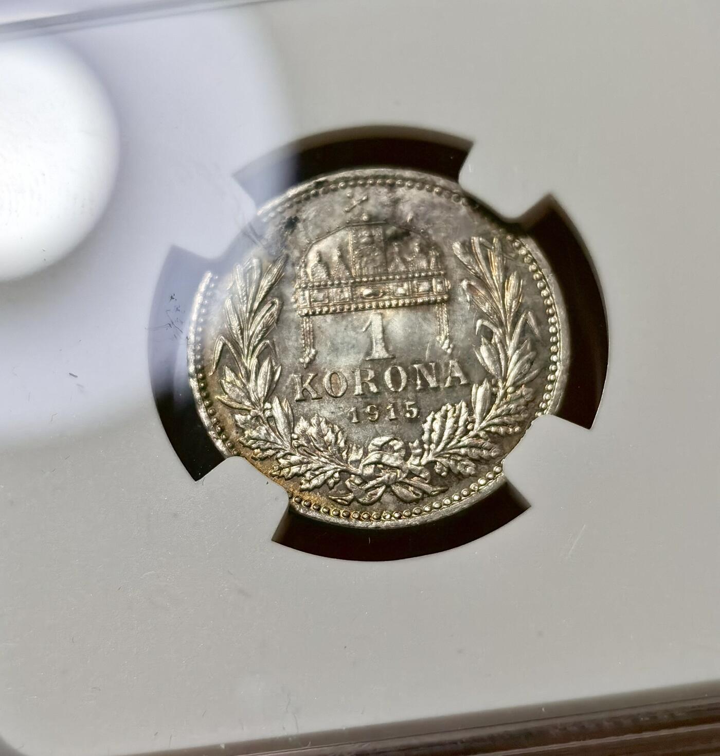 甄臻铺-世界币章拍卖（第40期）送拍享返佣金等优惠多多 NGC-MS63 奥匈帝国1915科罗娜银币，很少见的匈牙利版，正面环五彩包浆，背面镜面感非常强，状态满分的一枚，略有低评