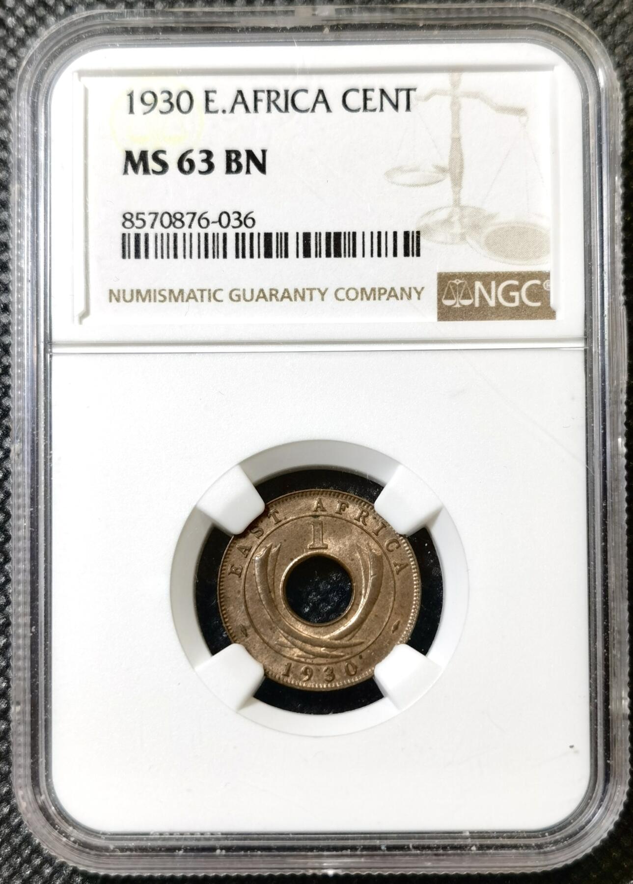 甄臻铺-世界币章拍卖（第40期）送拍享返佣金等优惠多多 NGC-MS63BN 英属东非中孔一分，有趣的中孔币，铜光满溢，状态非常好，经典殖民地品种
