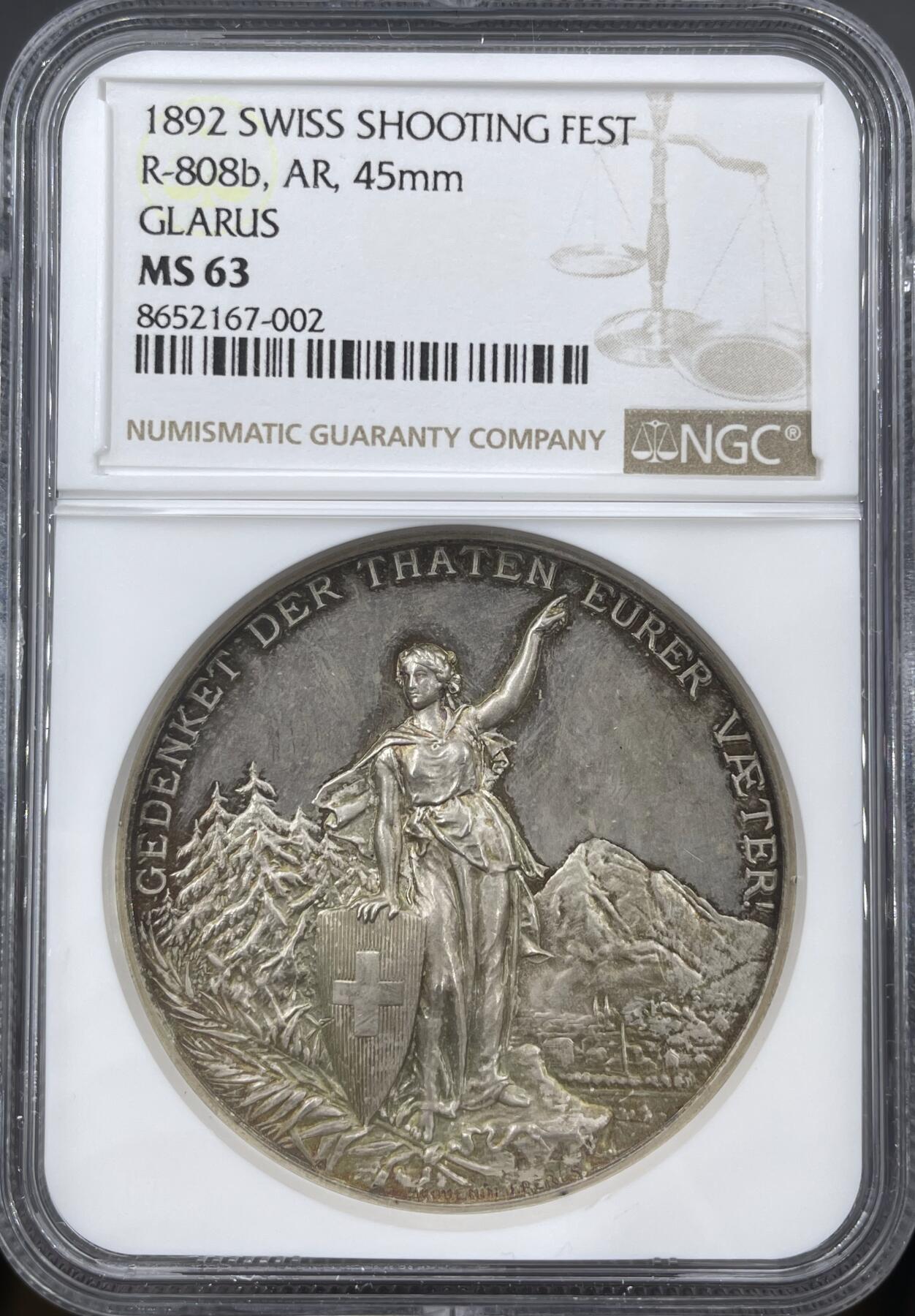 「木头集藏」章牌精品专场！ Huguenin～1892瑞士格拉鲁斯射击节银章，MS63 ，直径：45mm，38 g，NGC加厚盒，经典射击节品种，设计精美，包浆很漂亮。