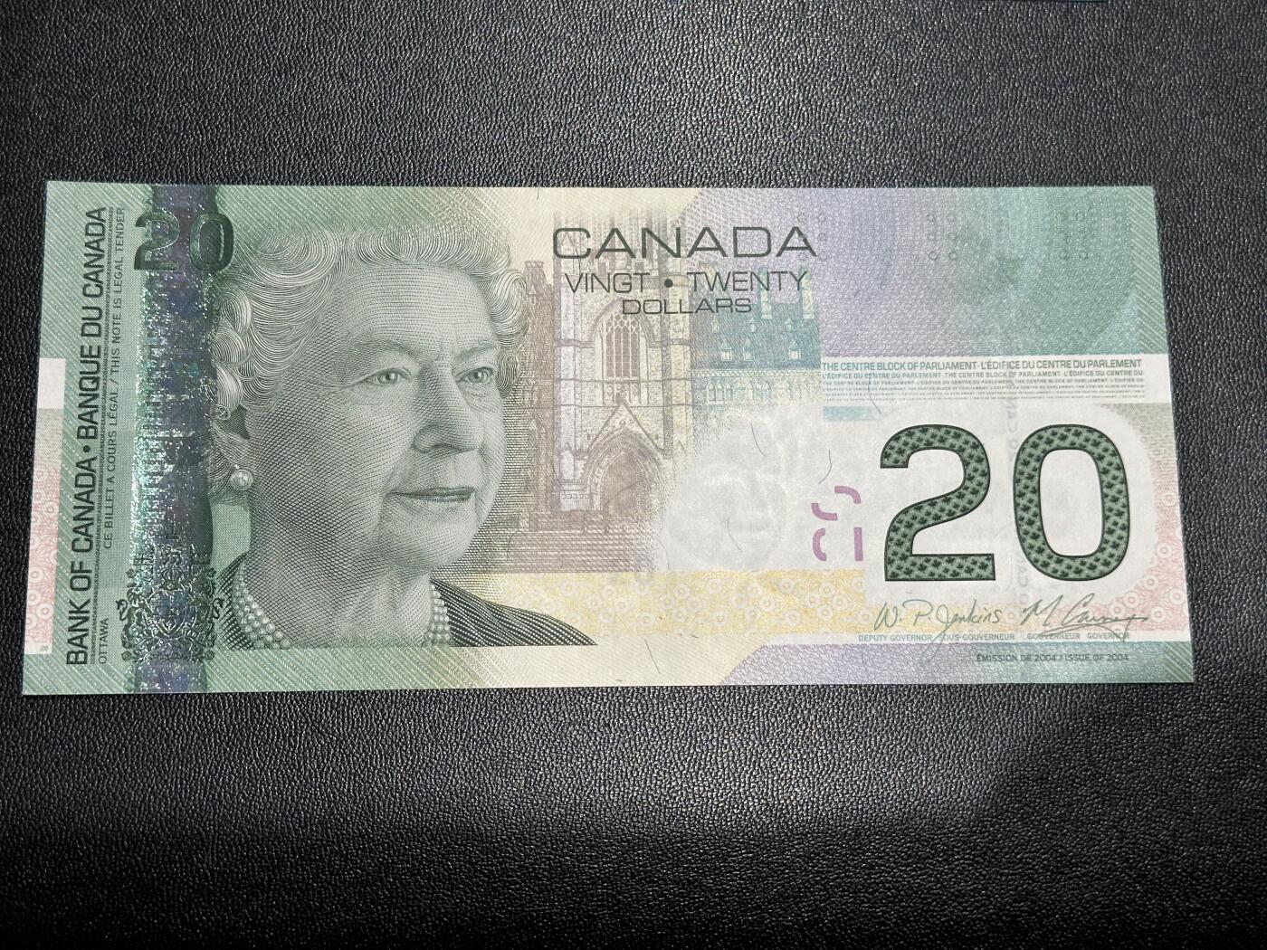 《外钞收藏家》第五百八十八期（优质场）（本平台长期征集拍品、欢迎藏友们联系合作） 加拿大之旅系列20元（2004年IBNS世界最佳纸币，全程无47）	UNC 有个压痕