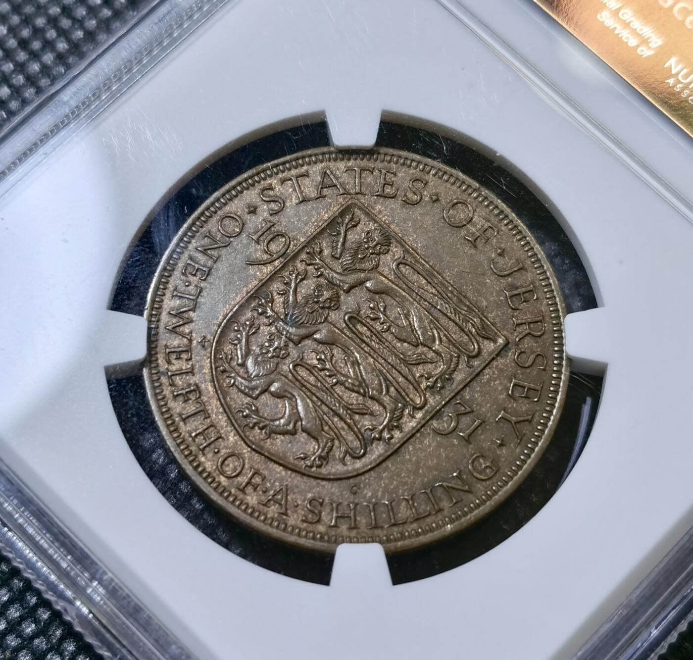甄臻铺-世界币章拍卖（第40期）送拍享返佣金等优惠多多 NGC-MS63BN 1931年英属泽西岛1/12先令大铜币，少见版本，比本土的少很多，巧克力包浆很好看