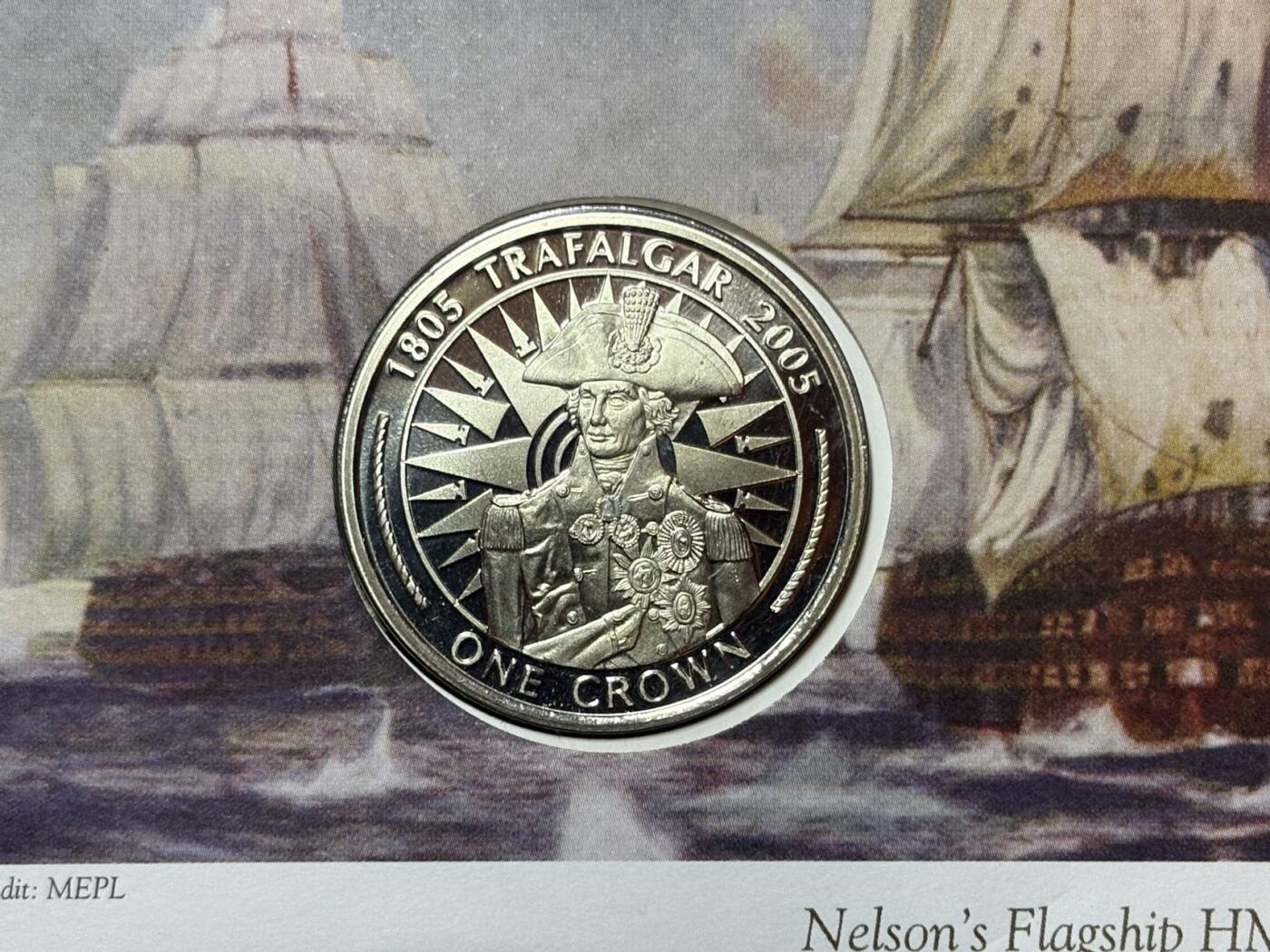 盛世勋华——号角文化勋章邮票专场拍卖第291期 英国马恩岛2005年特拉法尔加海战200周年纪念币首日收藏封，含邮票、插画、克朗型纪念币封装，限量发行，编号0601，纪念1805年英国海军在特拉法尔加海战中击败法西联合舰队的战役，主角是英国海军名将纳尔逊的旗舰“胜利号（HMS Victory）”，2005年是该战役200周年纪念节点。