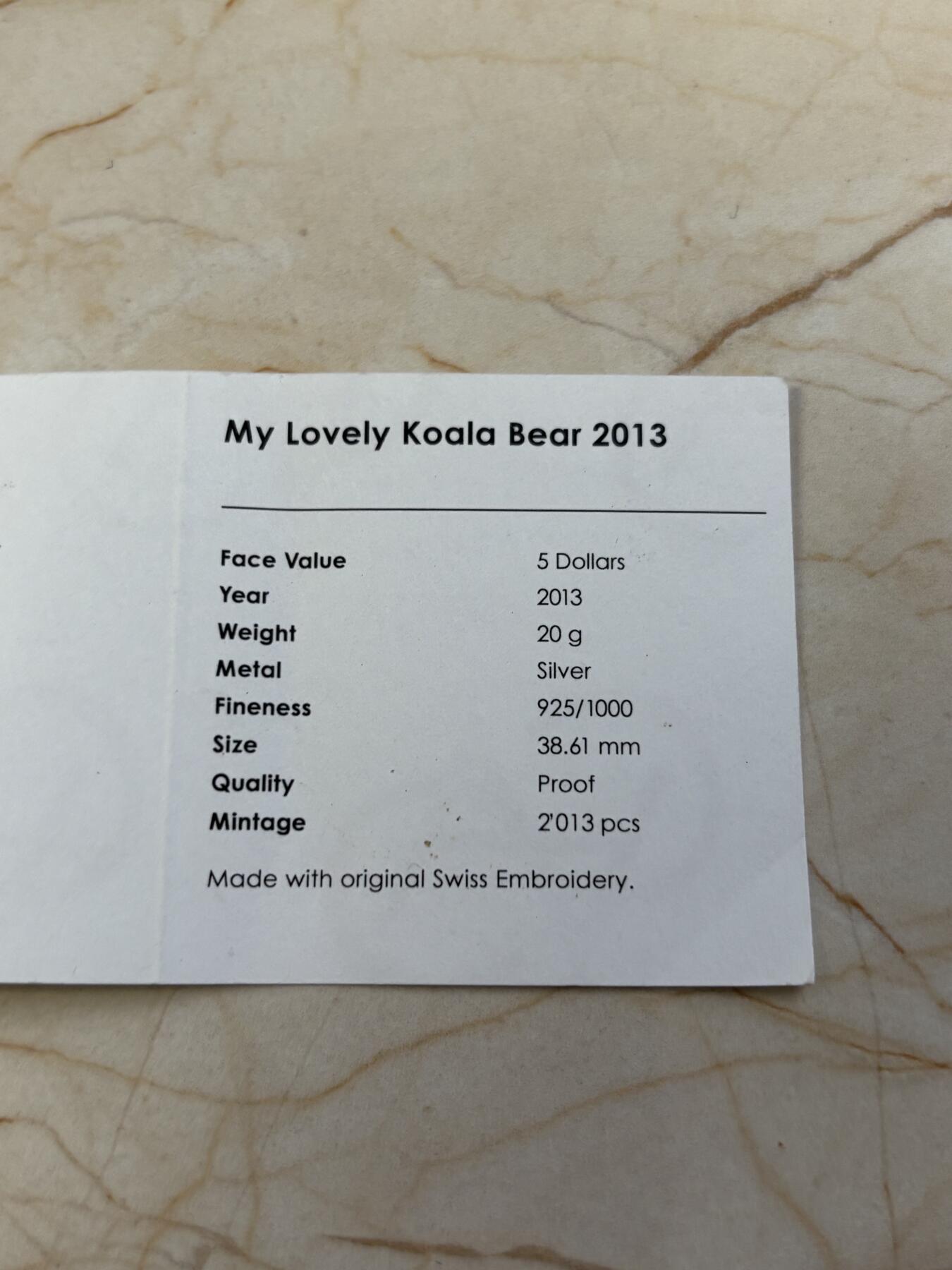 第183期拍卖 帕劳2013年考拉镶嵌实体瑞士刺绣针织纪念银币带证书，925银，25克，发行2013枚，有氧化