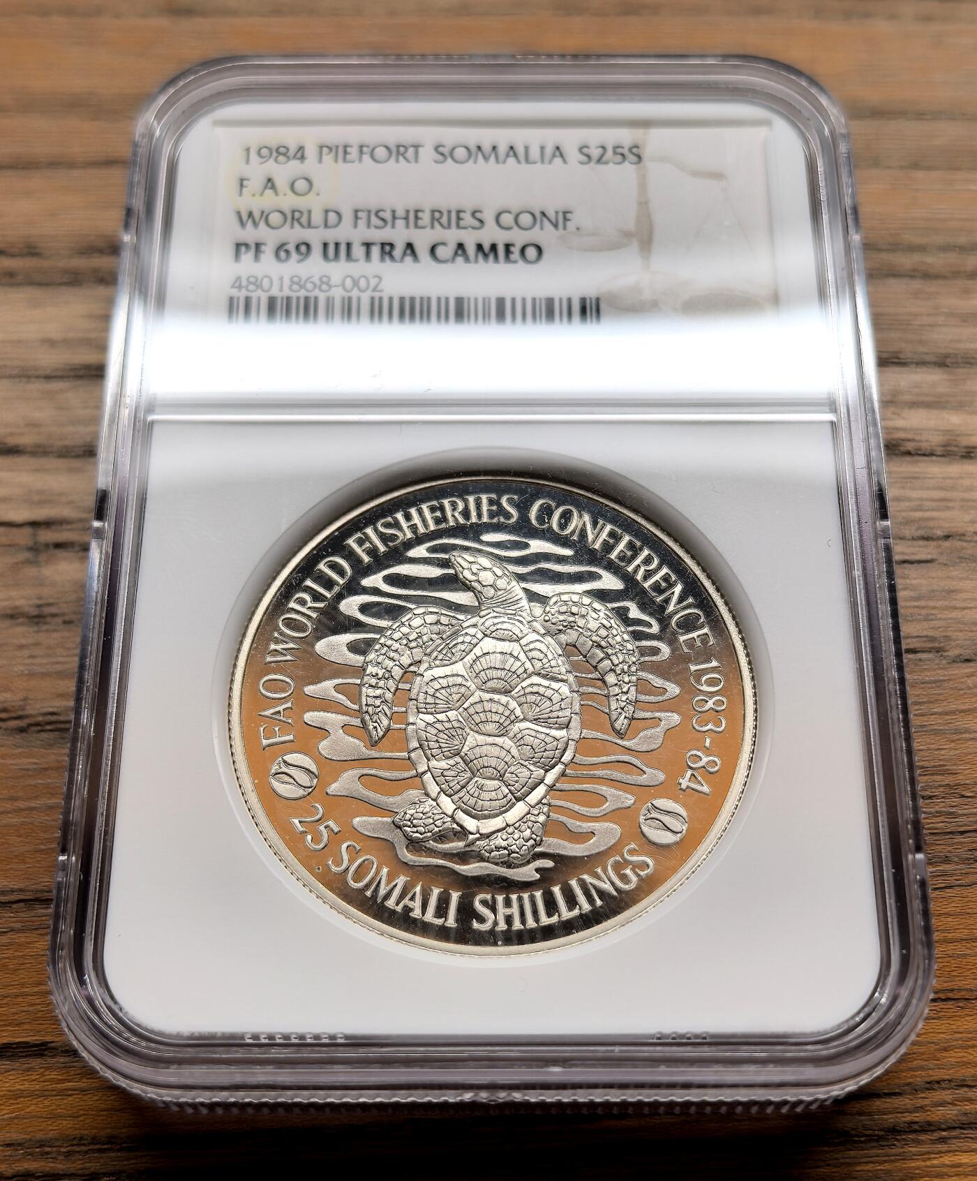 纫秋兰以为佩·凡希社微拍感恩专场 1984索马里FAO渔业会议25S大银加厚版NGC-PF69UC