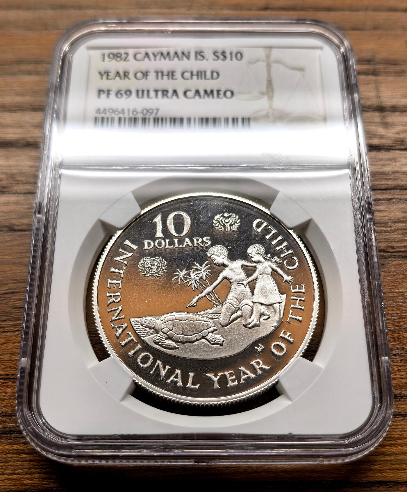 纫秋兰以为佩·凡希社微拍感恩专场 1982开曼群岛儿童年10元大银NGC-PF69UC