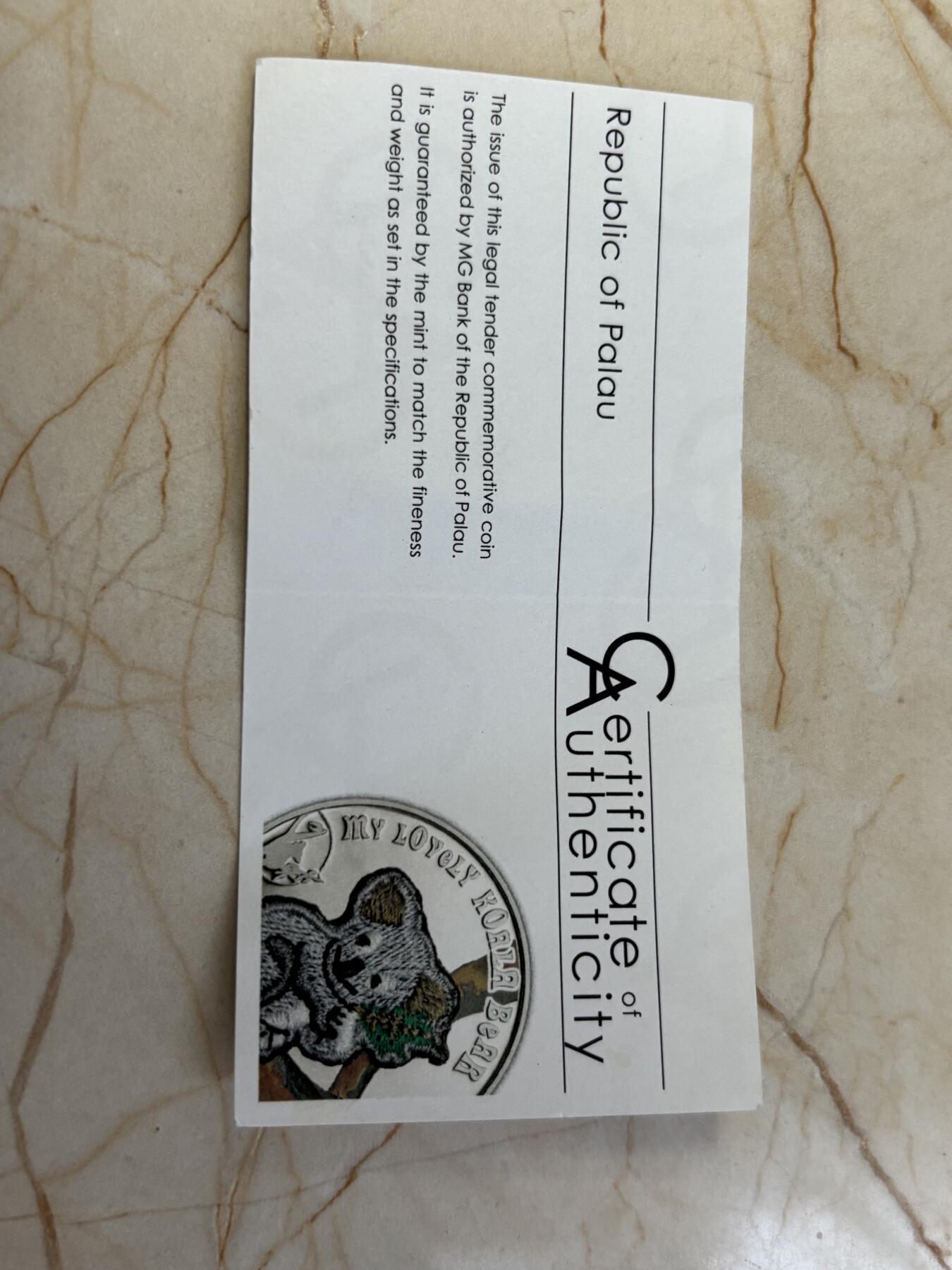 第183期拍卖 帕劳2013年考拉镶嵌实体瑞士刺绣针织纪念银币带证书，925银，25克，发行2013枚，有氧化