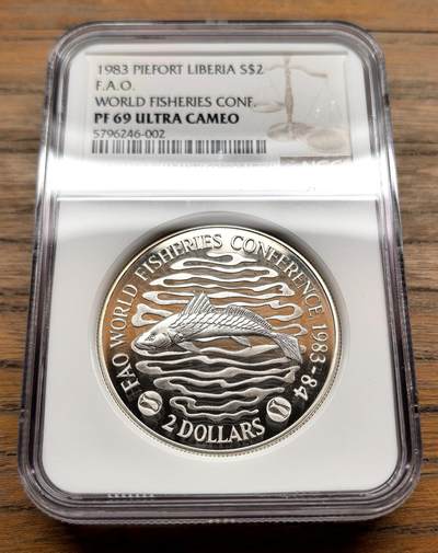 纫秋兰以为佩·凡希社微拍感恩专场 - 1983利比里亚FAO渔业会议2DOLLAR大银加厚版NGC-PF69UC
