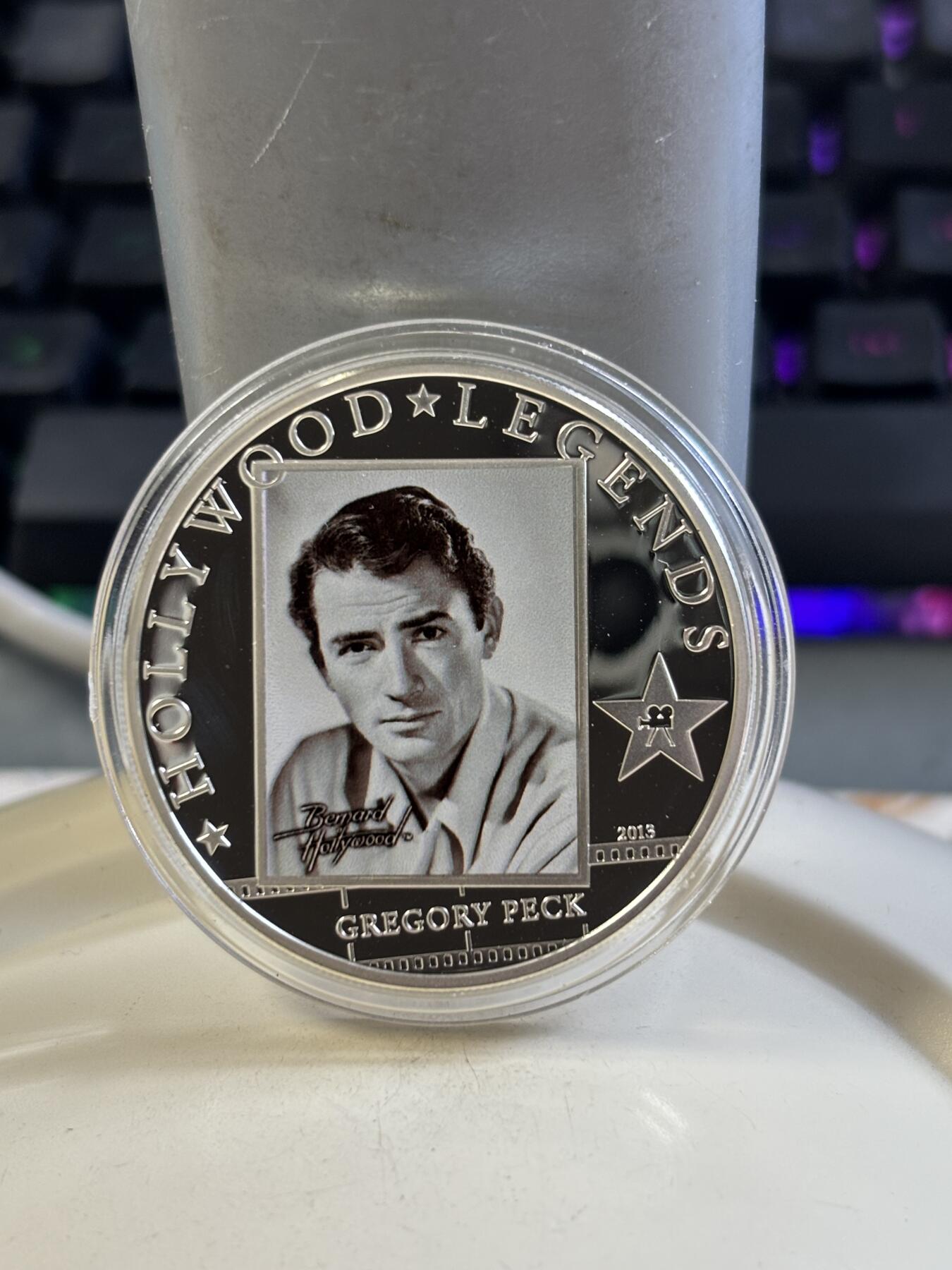 第183期拍卖 库克2013年好莱坞明星“格利高里·派克”精制彩色纪念银币带证书，25克，925银，发行量2500枚