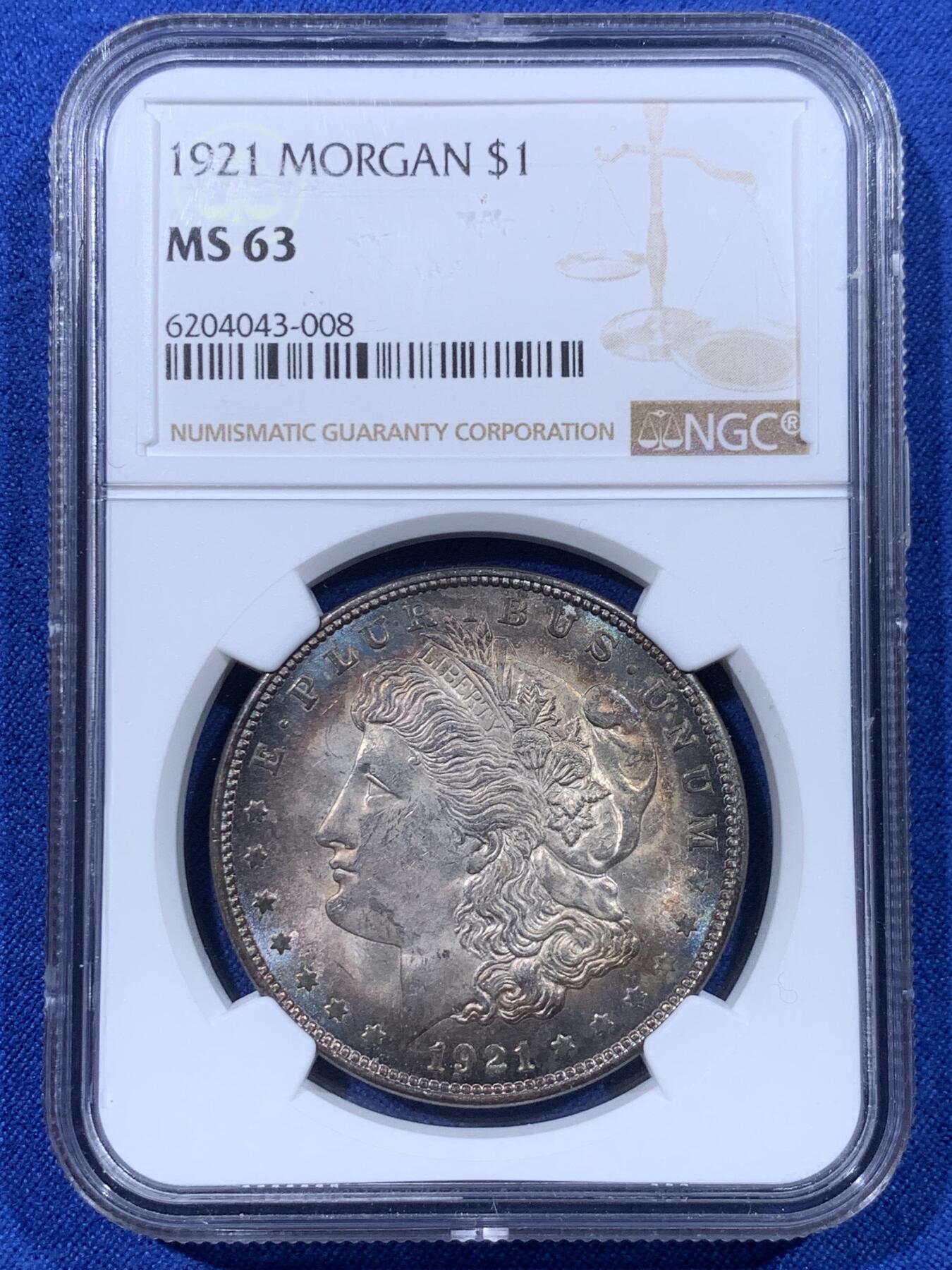 《竞宝斋》第443场 周日，周一，2场连拍 （全场包邮） NGC MS63 美国1921年摩根银币 卷首币，女神面均匀酱环彩，这种酱彩在国币上常见，在摩根上罕见。1921年关门年份摩根，彩币极少，这样均匀环彩更少。