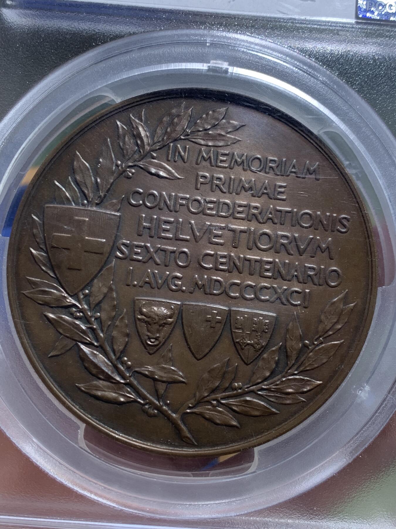 《竞宝斋》第443场 周日，周一，2场连拍 （全场包邮） PCGS SP63 亚军分 瑞士1891年联邦600周年飞天清凉女神大铜章，68mm大规格，151g，厚重压手。背生双翼的飞天女神在山间翱翔，手持火炬与橄榄枝，画面生动美好。收藏级大尺寸清凉章，更高仅1枚64，加厚盒。