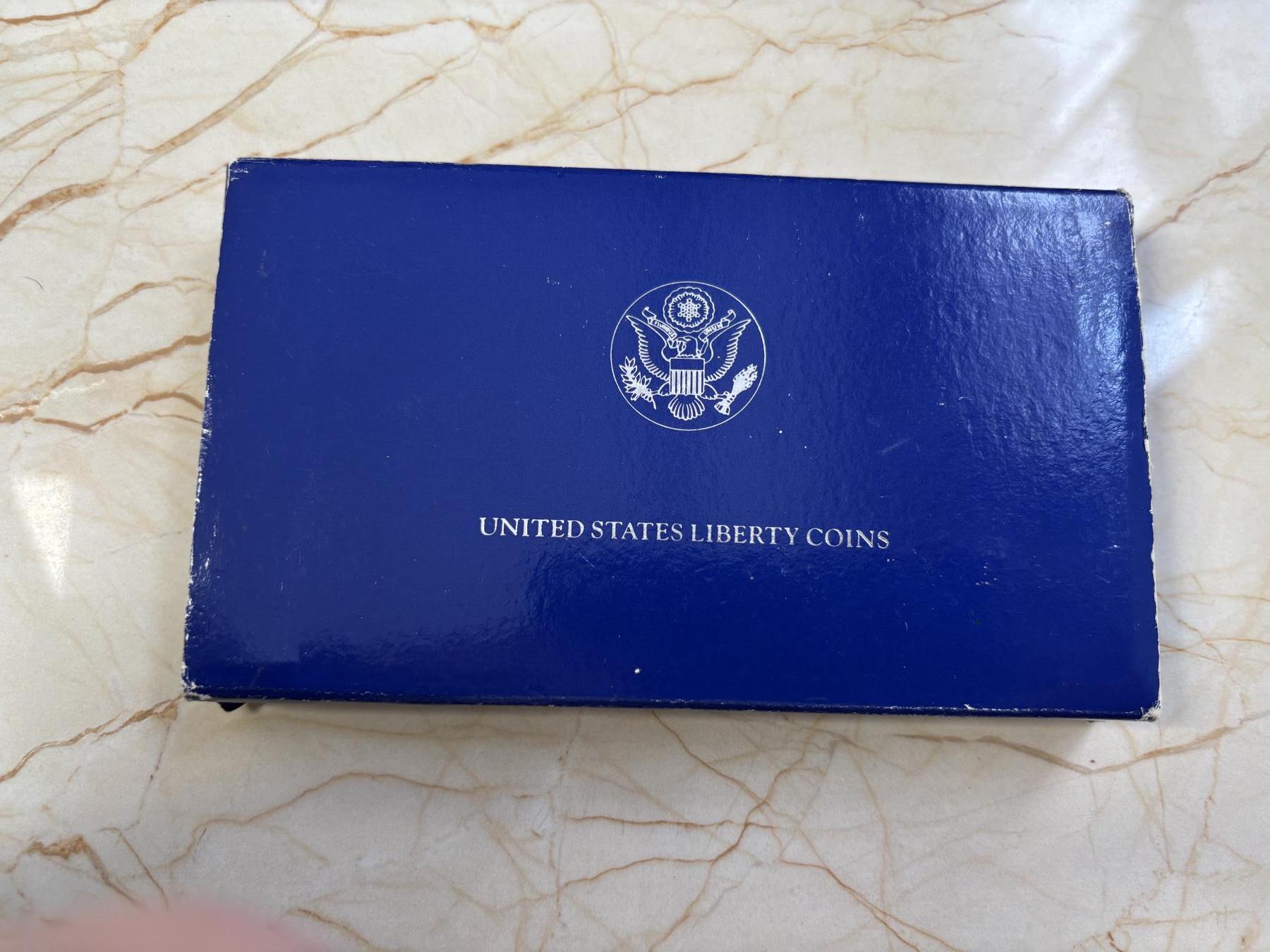 第183期拍卖 1986年美国双币套 自由女神纪念银币和铜镍币（1美元+半美元） 26.73克900银 盒证全