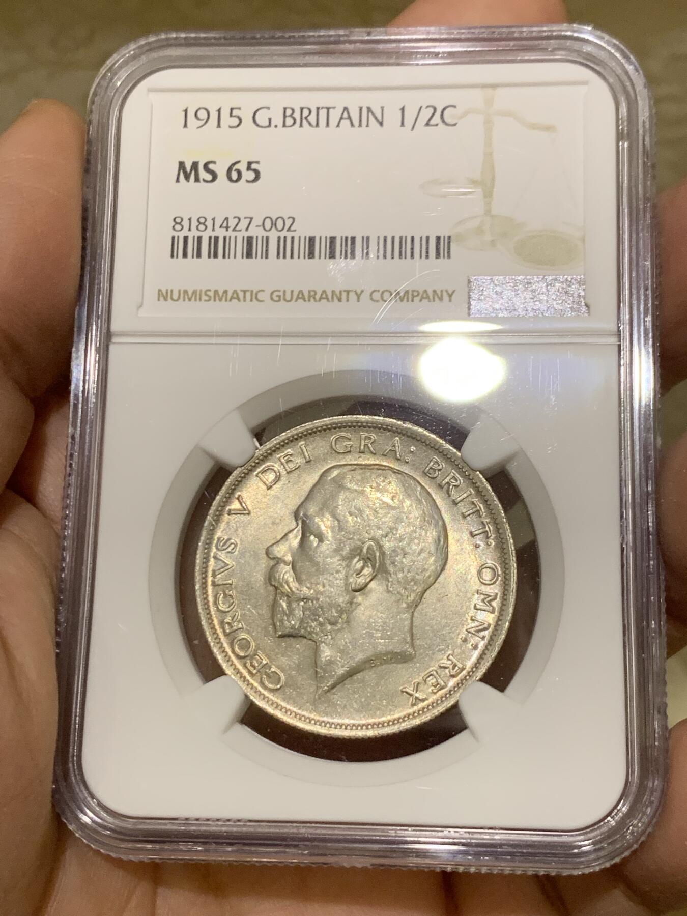 《竞宝斋》第443场 周日，周一，2场连拍 （全场包邮） NGC MS65 英国1915乔治五世流通半克朗银币，转光四溢，银色清爽，收藏级品质。流通版能到65分难度大，书价365美刀，是64分的近两倍。