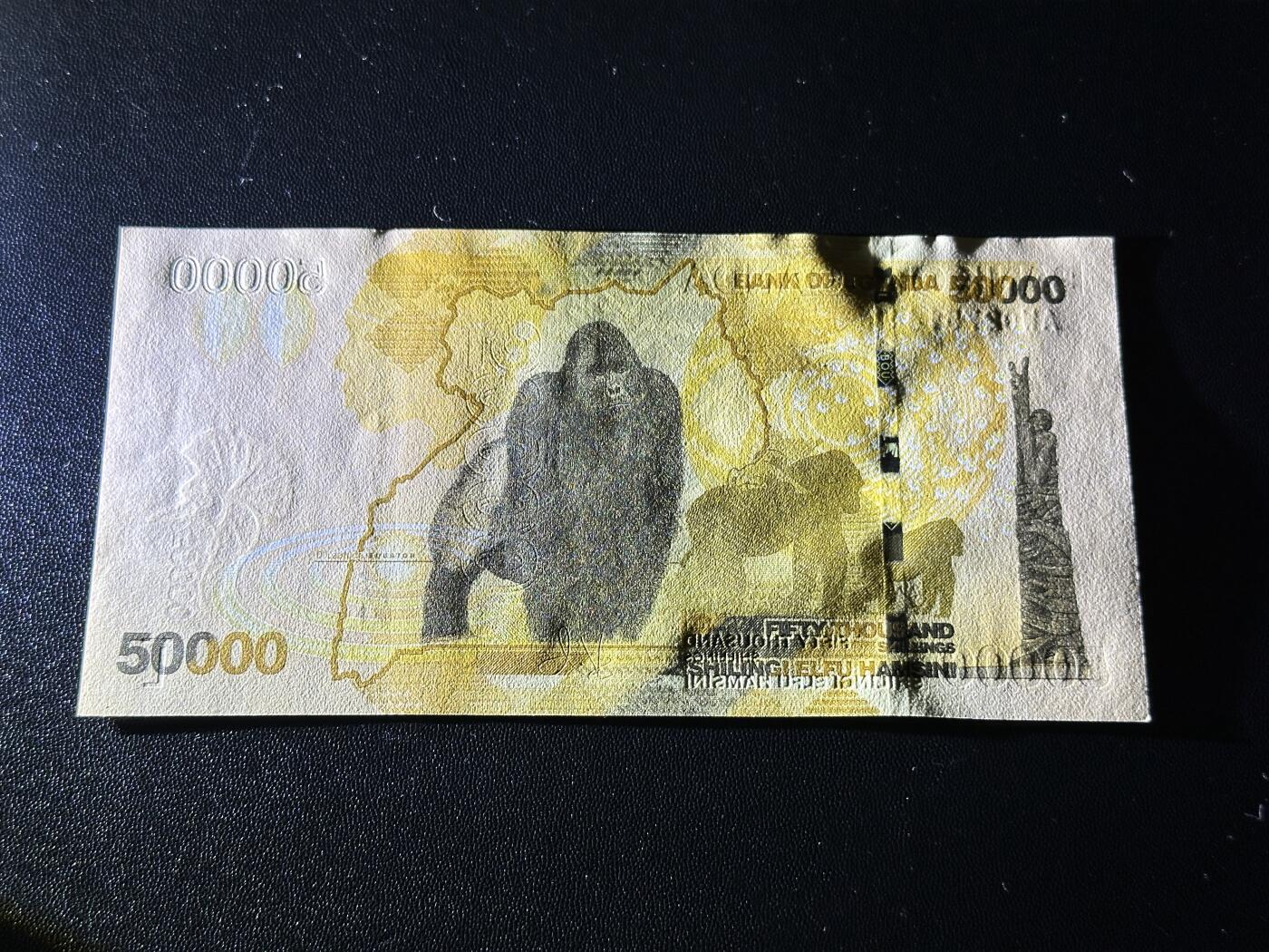 《外钞收藏家》第五百九十期（欧洲强钞、港币、硬通货及丰富裸币大拍场）（本平台长期征集拍品、欢迎藏友们联系合作） 2021年乌干达5万先令 全新UNC 大猩猩