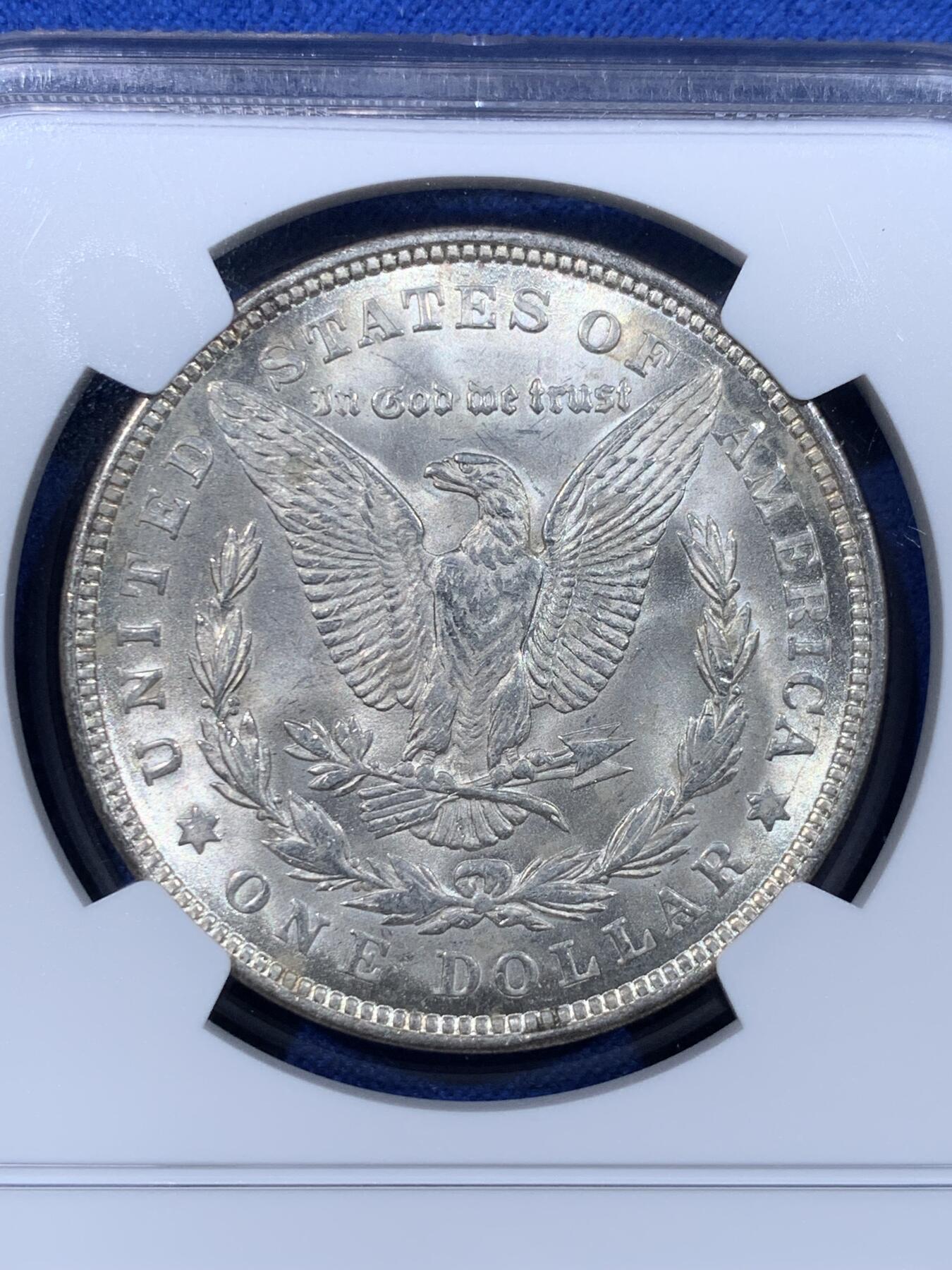 《竞宝斋》第443场 周日，周一，2场连拍 （全场包邮） NGC MS63 美国1921年摩根银币 卷首币，女神面均匀酱环彩，这种酱彩在国币上常见，在摩根上罕见。1921年关门年份摩根，彩币极少，这样均匀环彩更少。