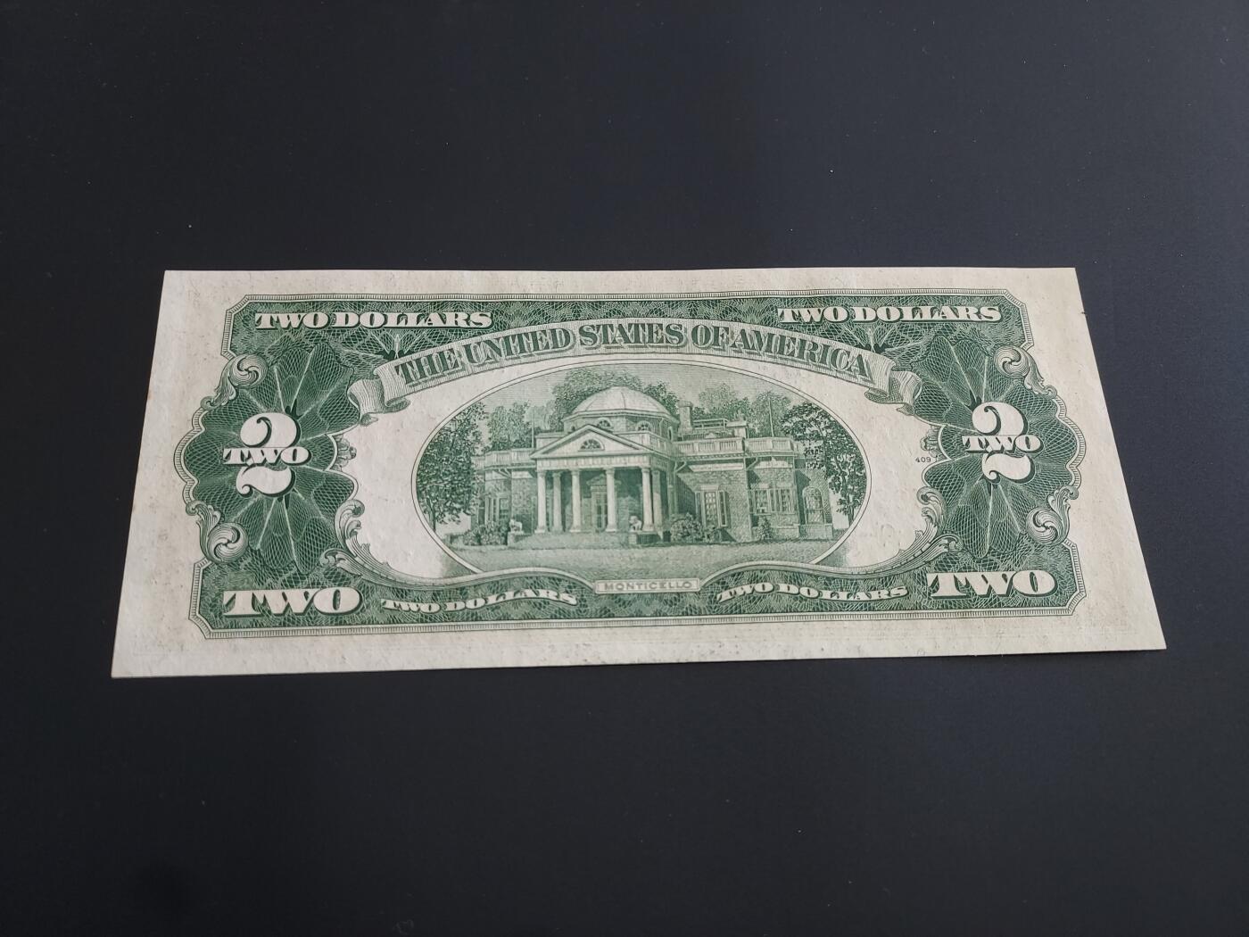 博彦收藏   12月8日 8点 钱币专场 1953 美国 红印2元 UNC 边有黄