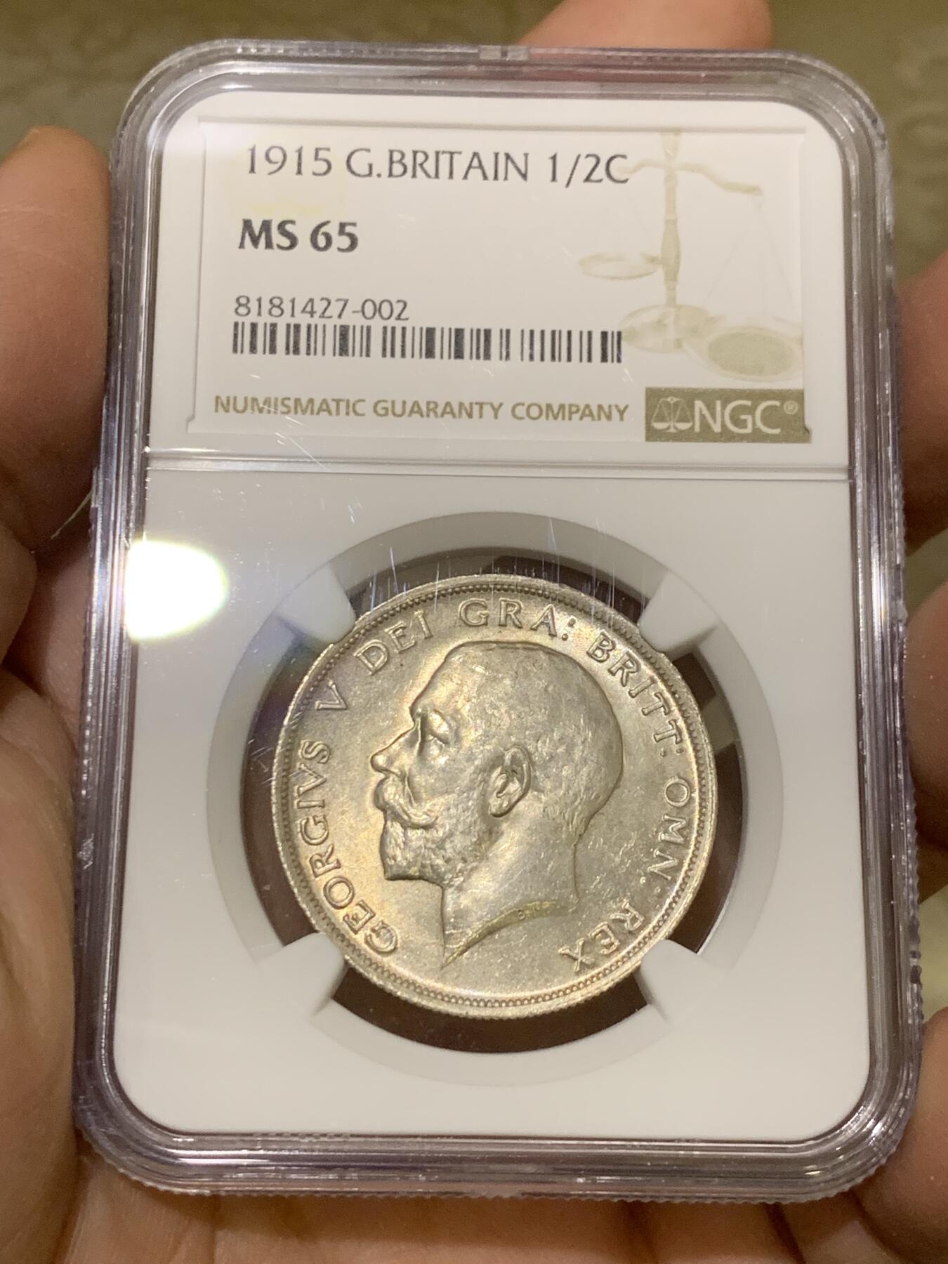 《竞宝斋》第443场 周日，周一，2场连拍 （全场包邮） NGC MS65 英国1915乔治五世流通半克朗银币，转光四溢，银色清爽，收藏级品质。流通版能到65分难度大，书价365美刀，是64分的近两倍。