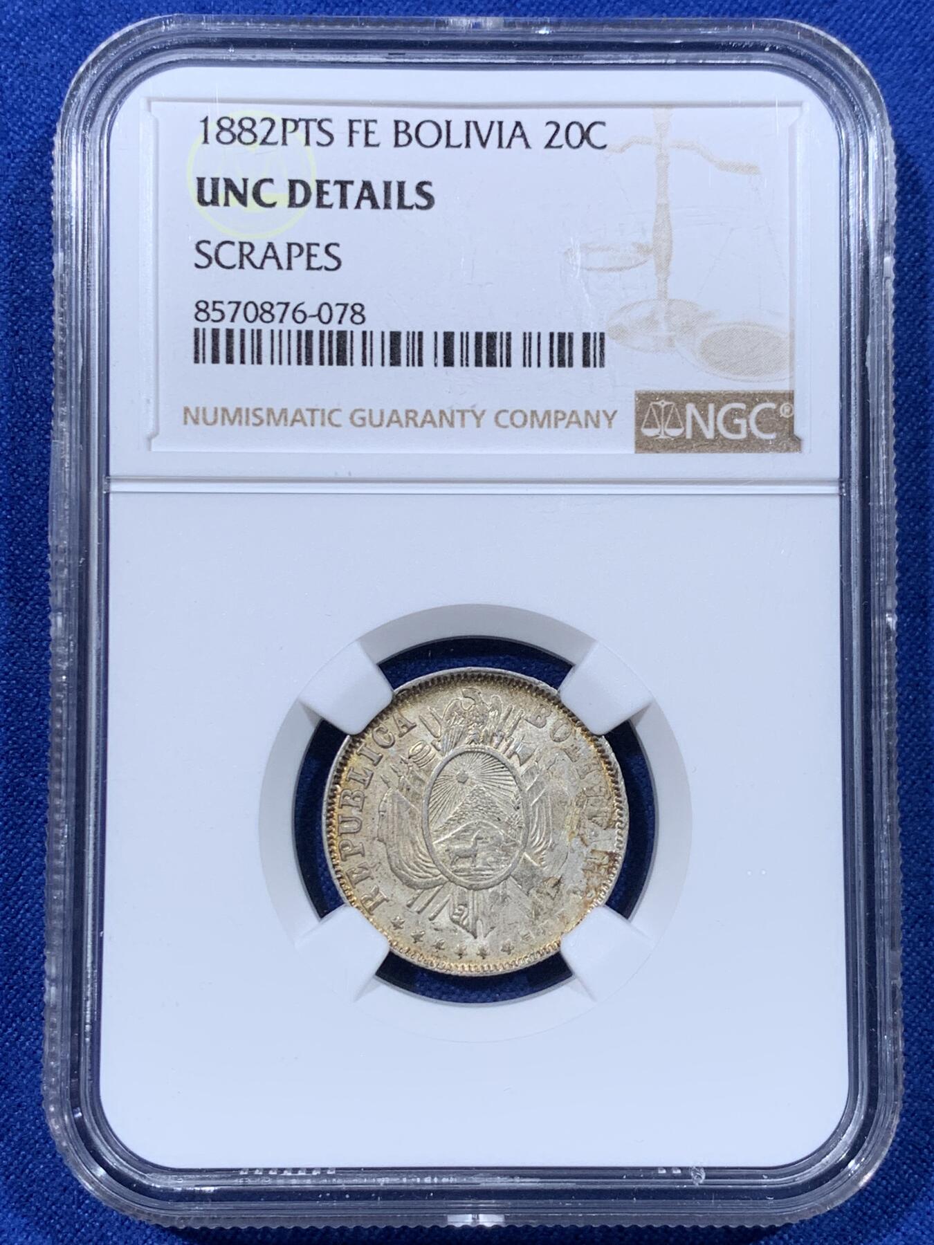 《竞宝斋》第443场 周日，周一，2场连拍 （全场包邮） NGC UNCD 玻利维亚1882二十分银币，淡彩包浆，转光漂亮，少见美洲品种，细节见图。