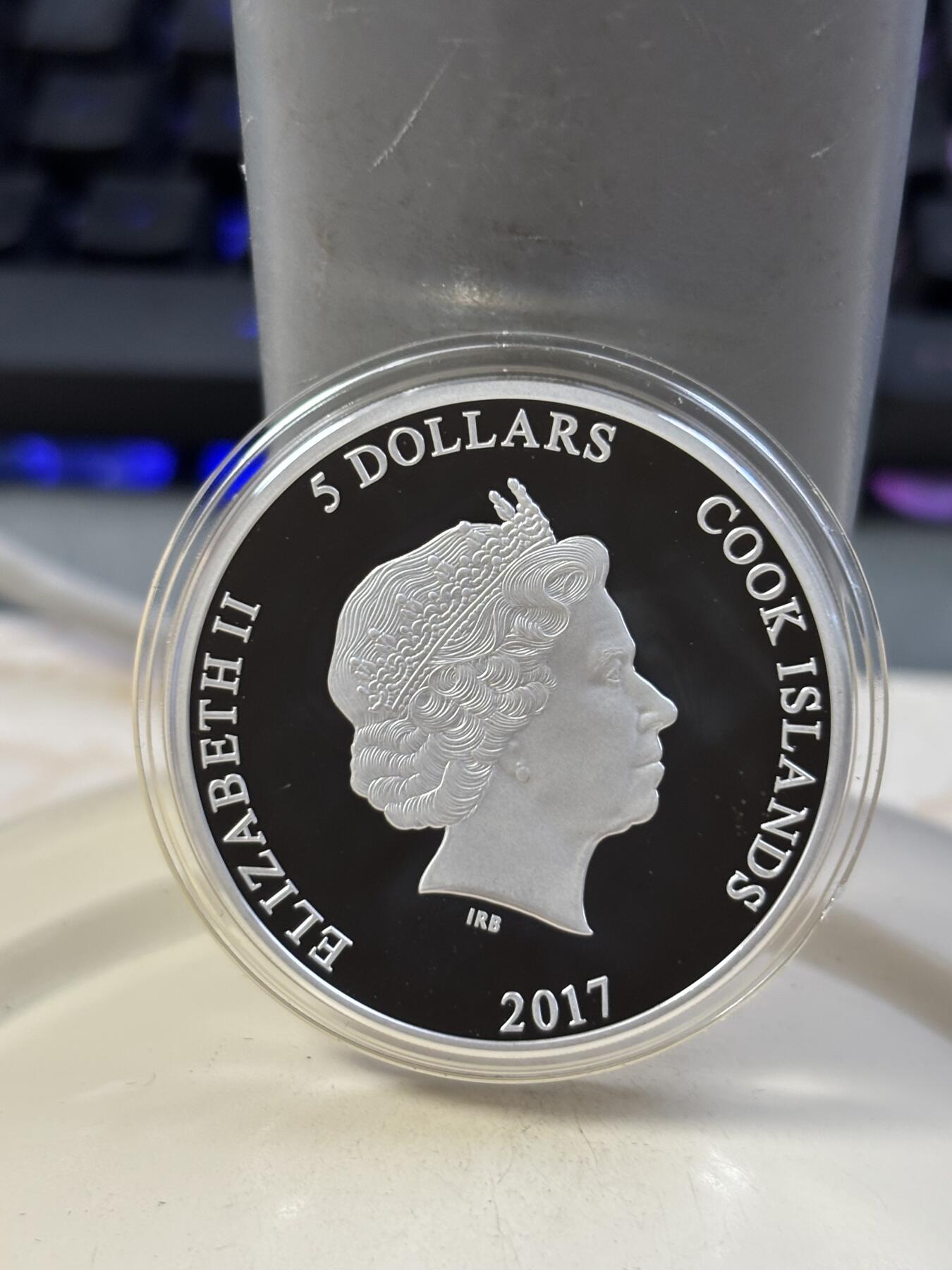 第184期拍卖 库克2017年哈利波特神奇野兽高浮雕纪念银币，1盎司，999银，