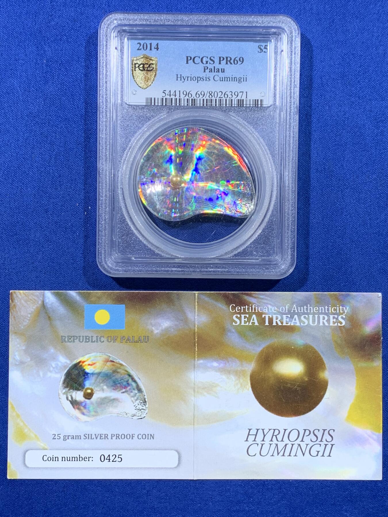 《竞宝斋》第443场 周日，周一，2场连拍 （全场包邮） PCGS PR69 帕劳2014年洋瑰宝4-三角蚌含珠本色（异形）5元精制纪念银币（最美的仿生银币之一  25克，999银，41MM币径，稀有限量发行1500枚，加厚盒，带证书）