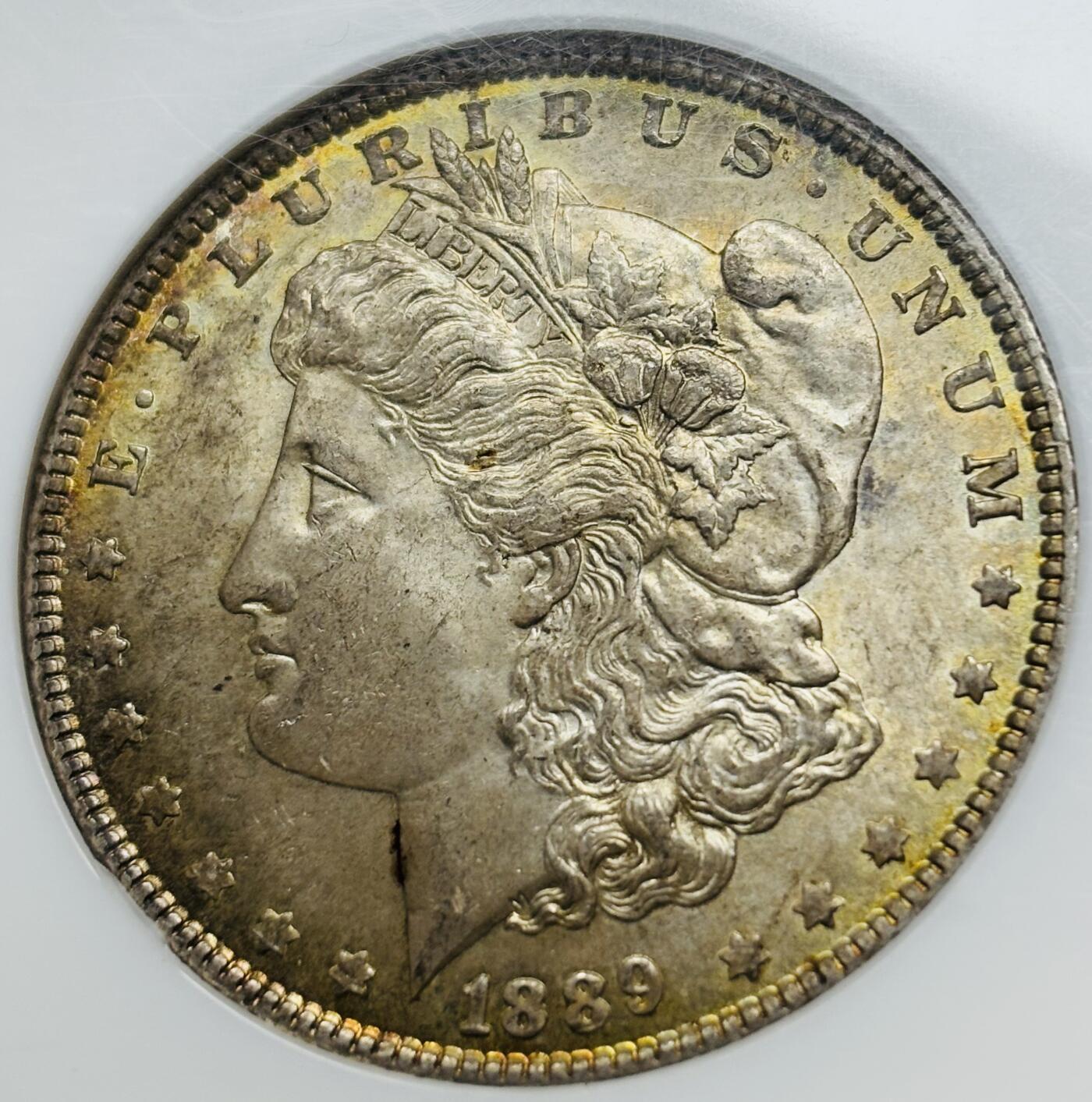 文馨钱币收藏第 283 场，【大雪鉴珍，寒英缀金】金银纪念币精品场，诚邀您的参与【长期接代拍品】 1889 年美国摩根鹰洋，早期老盒 NGC 评级 MS64 分，正宗黄油转光包浆，特别养眼，炫光感强，老盒出分把控更加严格，64 分已属不易