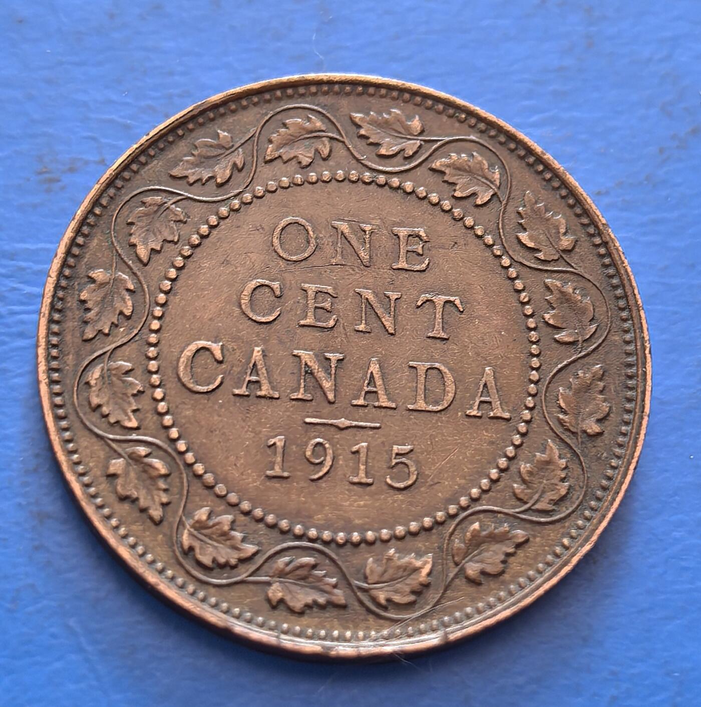 外国优质老铜币银币，周六九点倒数截拍，满百包邮，可寄存半年，喜欢朋友微信扫描二维码可直接参拍 加拿大1915年壹分连叶版