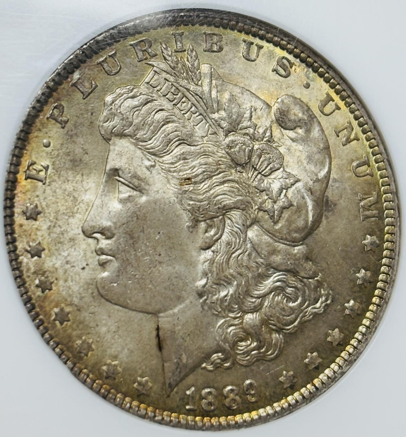 文馨钱币收藏第 283 场，【大雪鉴珍，寒英缀金】金银纪念币精品场，诚邀您的参与【长期接代拍品】 1889 年美国摩根鹰洋，早期老盒 NGC 评级 MS64 分，正宗黄油转光包浆，特别养眼，炫光感强，老盒出分把控更加严格，64 分已属不易