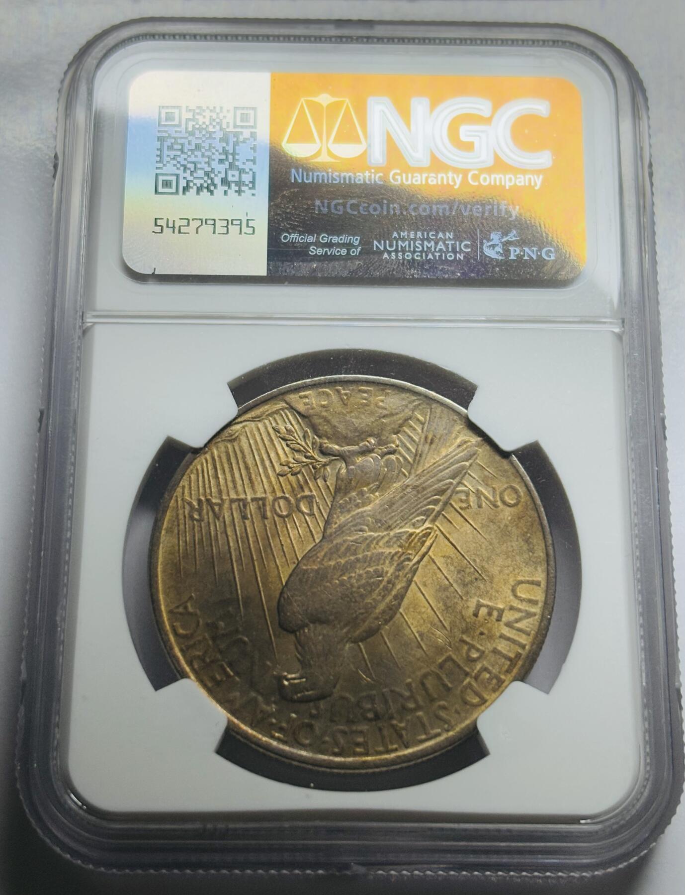 文馨钱币收藏第 283 场，【大雪鉴珍，寒英缀金】金银纪念币精品场，诚邀您的参与【长期接代拍品】 1922 年美国和平鸽一元银元，NGC 评级 AUD，金色包浆立体饱满，整体金黄状态，视觉感拉满