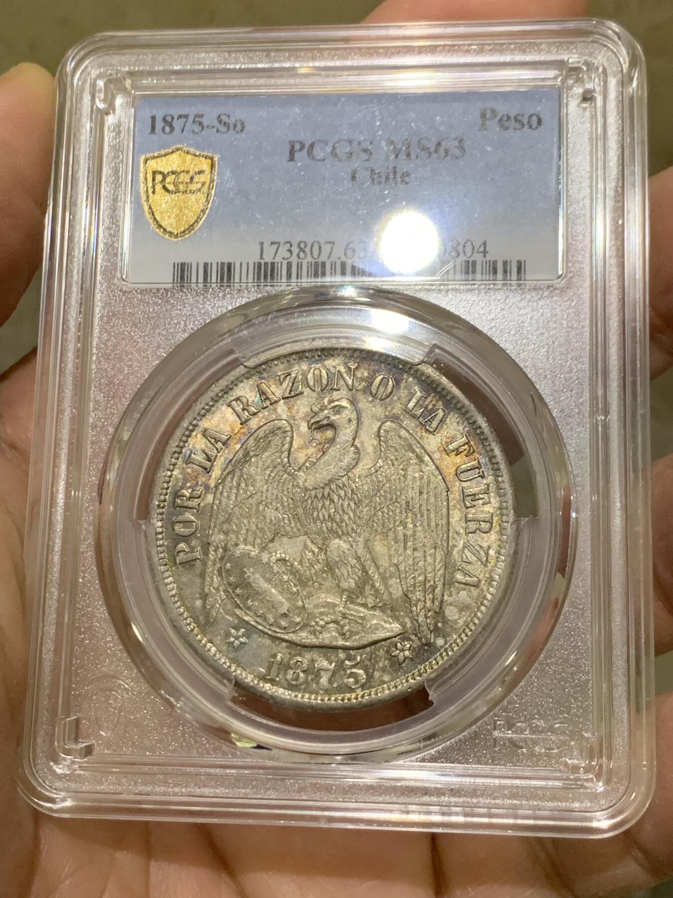 《竞宝斋》第444场 周日，周一，2场连拍 （全场包邮） PCGS MS63 智利 1875年 1比索 安第斯神鹰 银币 五彩包浆 季军分 更高分仅3枚