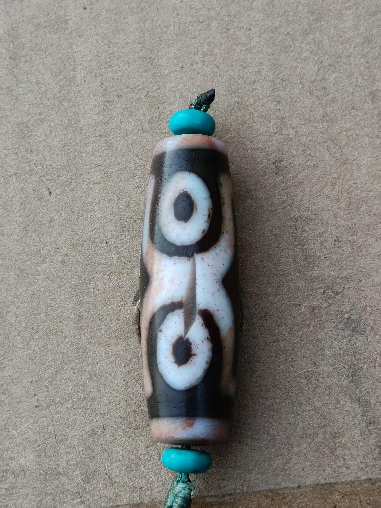 藏传四眼硃砂天珠