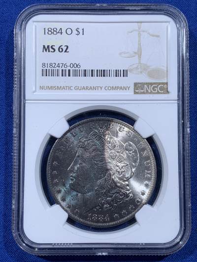 《竞宝斋》第444场 周日，周一，2场连拍 （全场包邮） - NGC MS62 美国1884年摩根银币O版，原汁原味深蓝彩老包浆，极美大月牙彩，包浆醇厚润泽，状态极佳，低评。