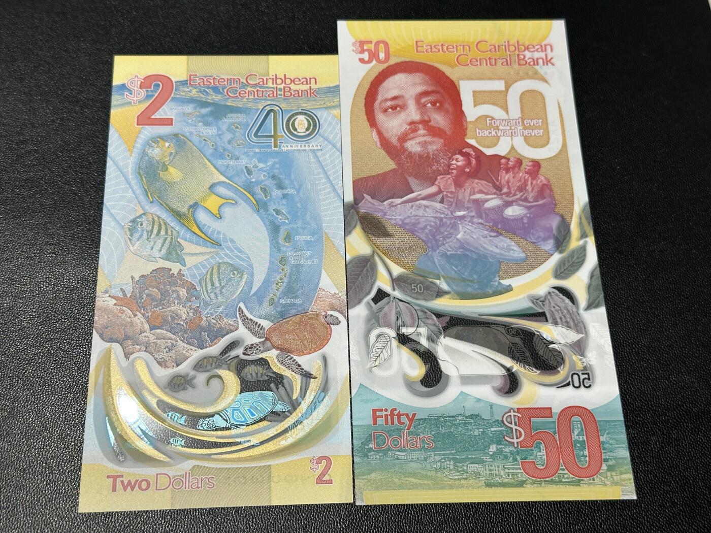 《外钞收藏家》第五百九十期（欧洲强钞、港币、硬通货及丰富裸币大拍场）（本平台长期征集拍品、欢迎藏友们联系合作） 东加勒比40和50面额 2张纪念钞一起 全新UNC 全部是靓号尾9