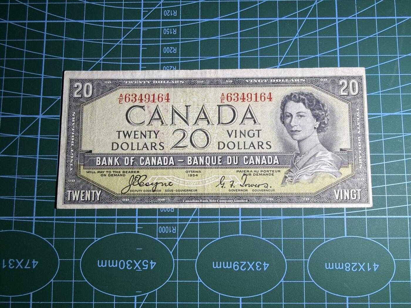 【炜奕收藏】，第五十二期 1954年加拿大20元，品相如图，魔鬼脸版