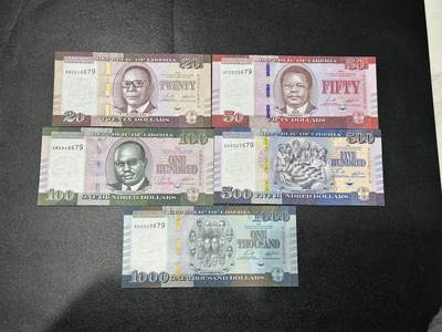 《外钞收藏家》第五百九十期（欧洲强钞、港币、硬通货及丰富裸币大拍场）（本平台长期征集拍品、欢迎藏友们联系合作） - 利比里亚20-1000面额 五张一起 全新UNC 尾679