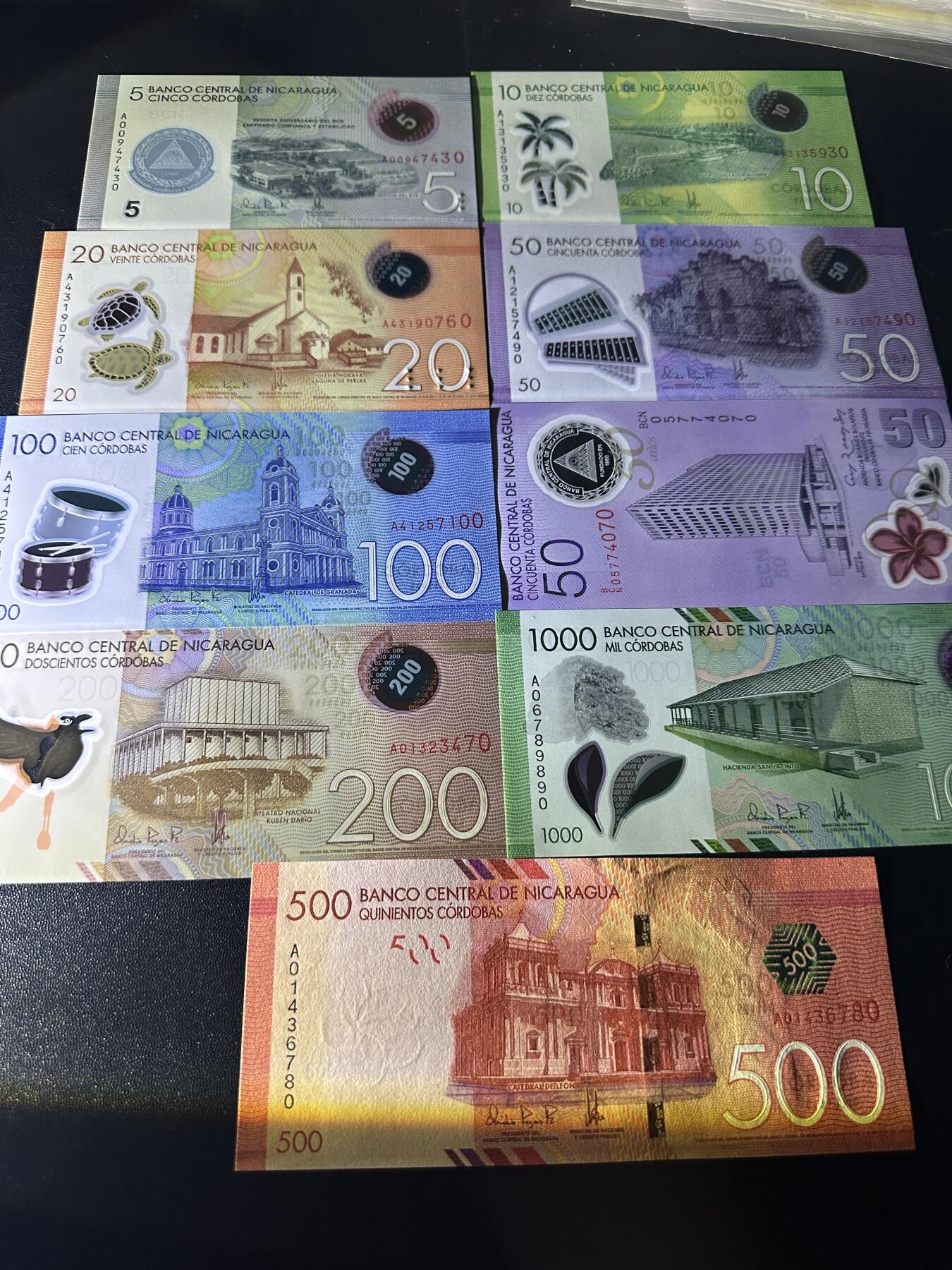 《外钞收藏家》第五百九十期（欧洲强钞、港币、硬通货及丰富裸币大拍场）（本平台长期征集拍品、欢迎藏友们联系合作） 尼加拉瓜5-1000面额 9张一起 全新UNC 全部是靓号尾0 期中50有2张 一张纪念钞