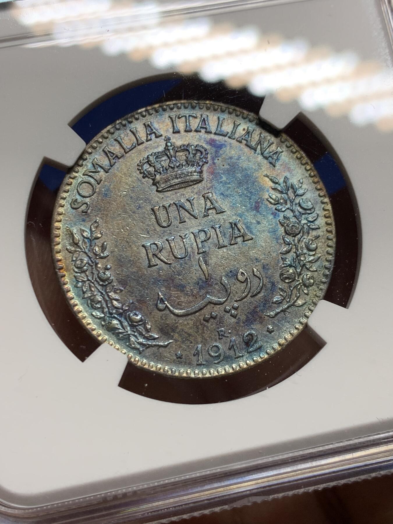 《竞宝斋》第444场 周日，周一，2场连拍 （全场包邮） NGC AUD 意属索马里1912年1卢比银币 蓝五彩包浆