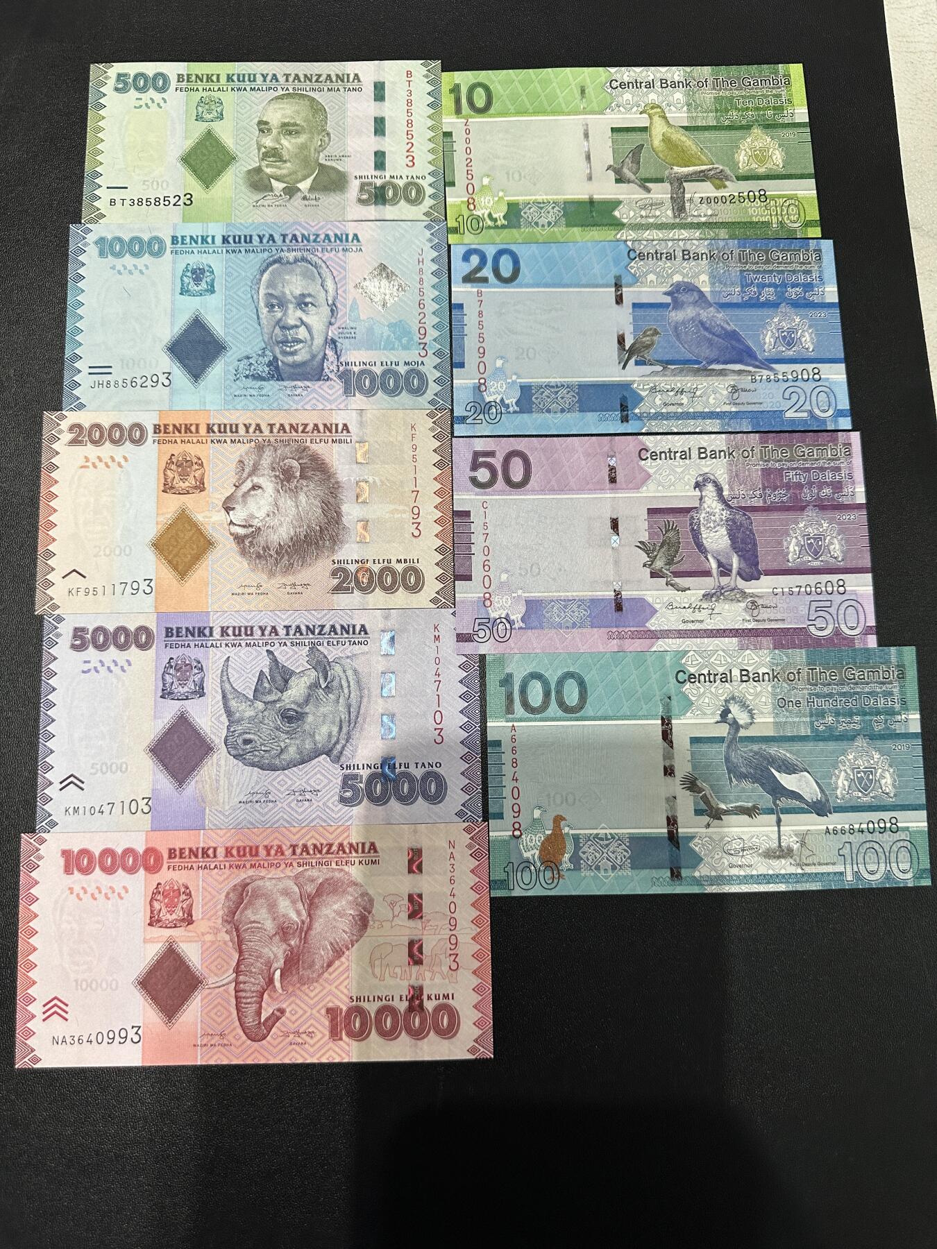 《外钞收藏家》第五百九十期（欧洲强钞、港币、硬通货及丰富裸币大拍场）（本平台长期征集拍品、欢迎藏友们联系合作） 坦桑尼亚和冈比亚2套一起 全新UNC 分别是尾3和尾8