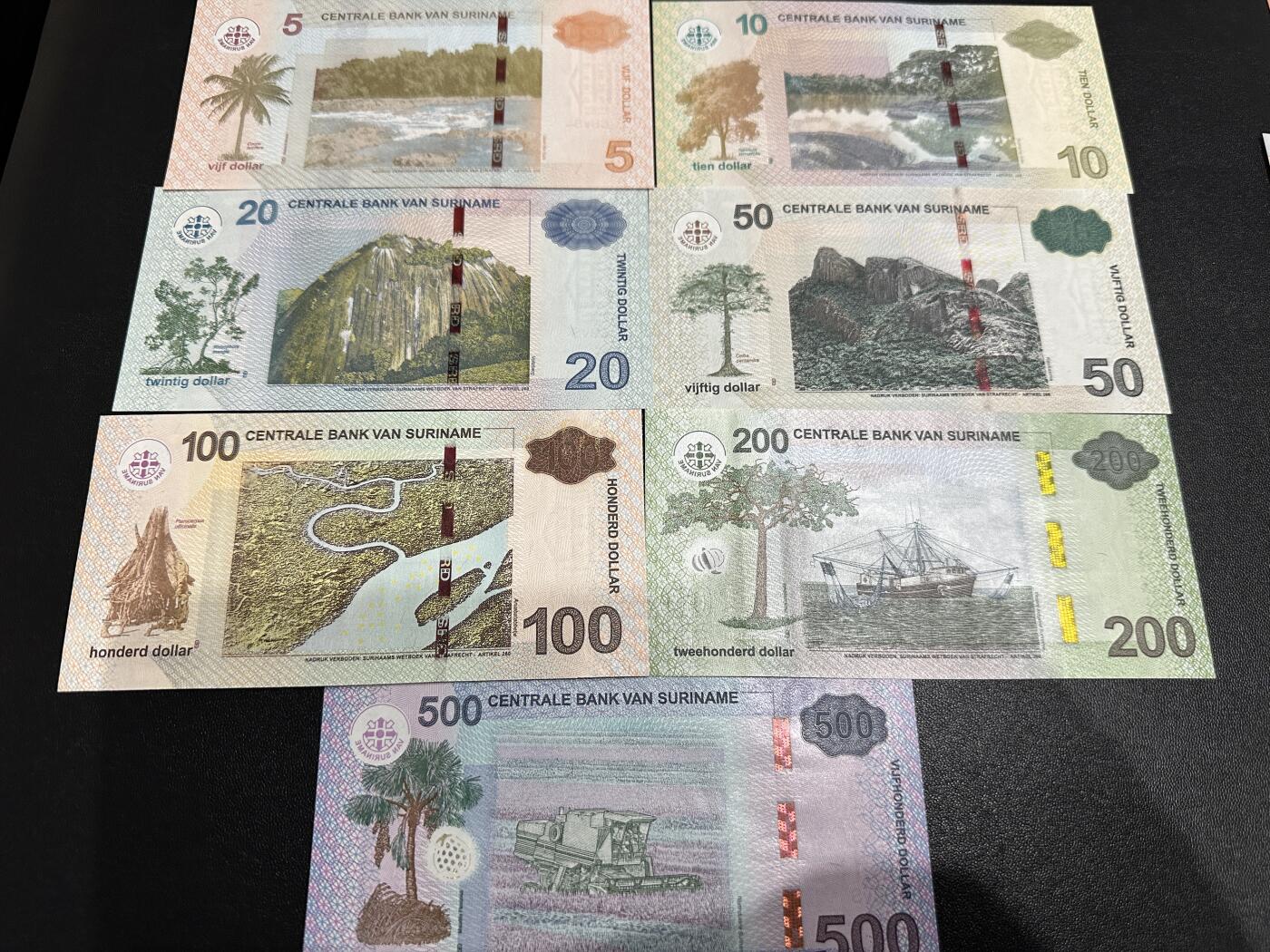 《外钞收藏家》第五百九十期（欧洲强钞、港币、硬通货及丰富裸币大拍场）（本平台长期征集拍品、欢迎藏友们联系合作） 苏里南5-500面额 七张一起 全新UNC 尾6