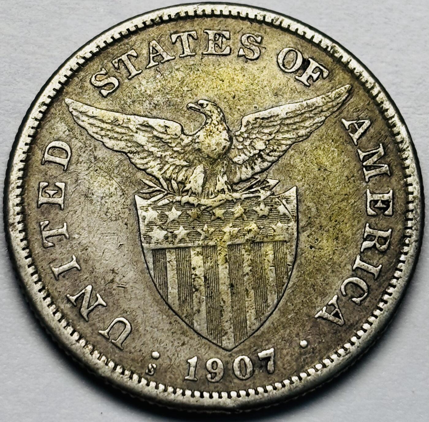 文馨钱币收藏第 283 场，【大雪鉴珍，寒英缀金】金银纪念币精品场，诚邀您的参与【长期接代拍品】 少见 1907 年美属菲律宾管辖时期 打铁女神 1 比索大银币，20 克 800 高银，第二版首发年