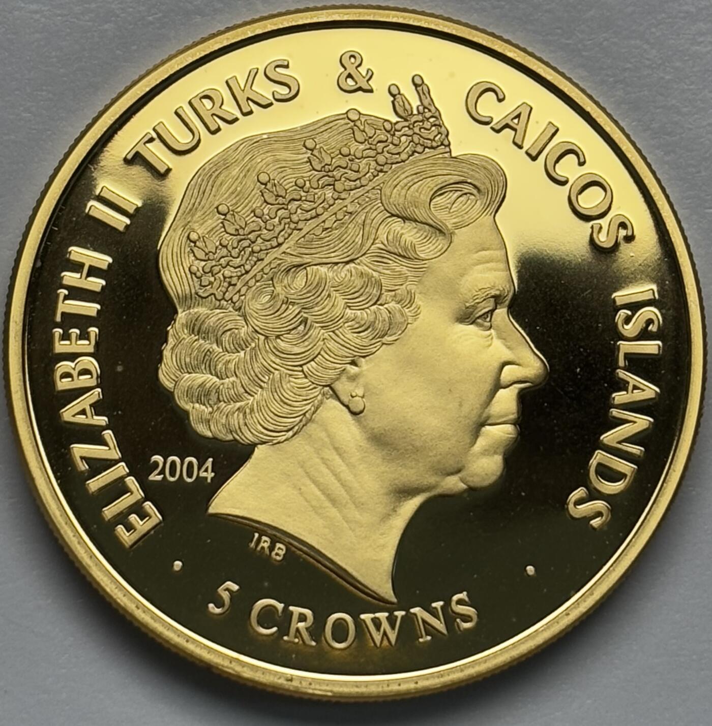 文馨钱币收藏第 283 场，【大雪鉴珍，寒英缀金】金银纪念币精品场，诚邀您的参与【长期接代拍品】 全新 2004 年特克斯和凯克斯群岛 5 克朗精制镀金纪念币